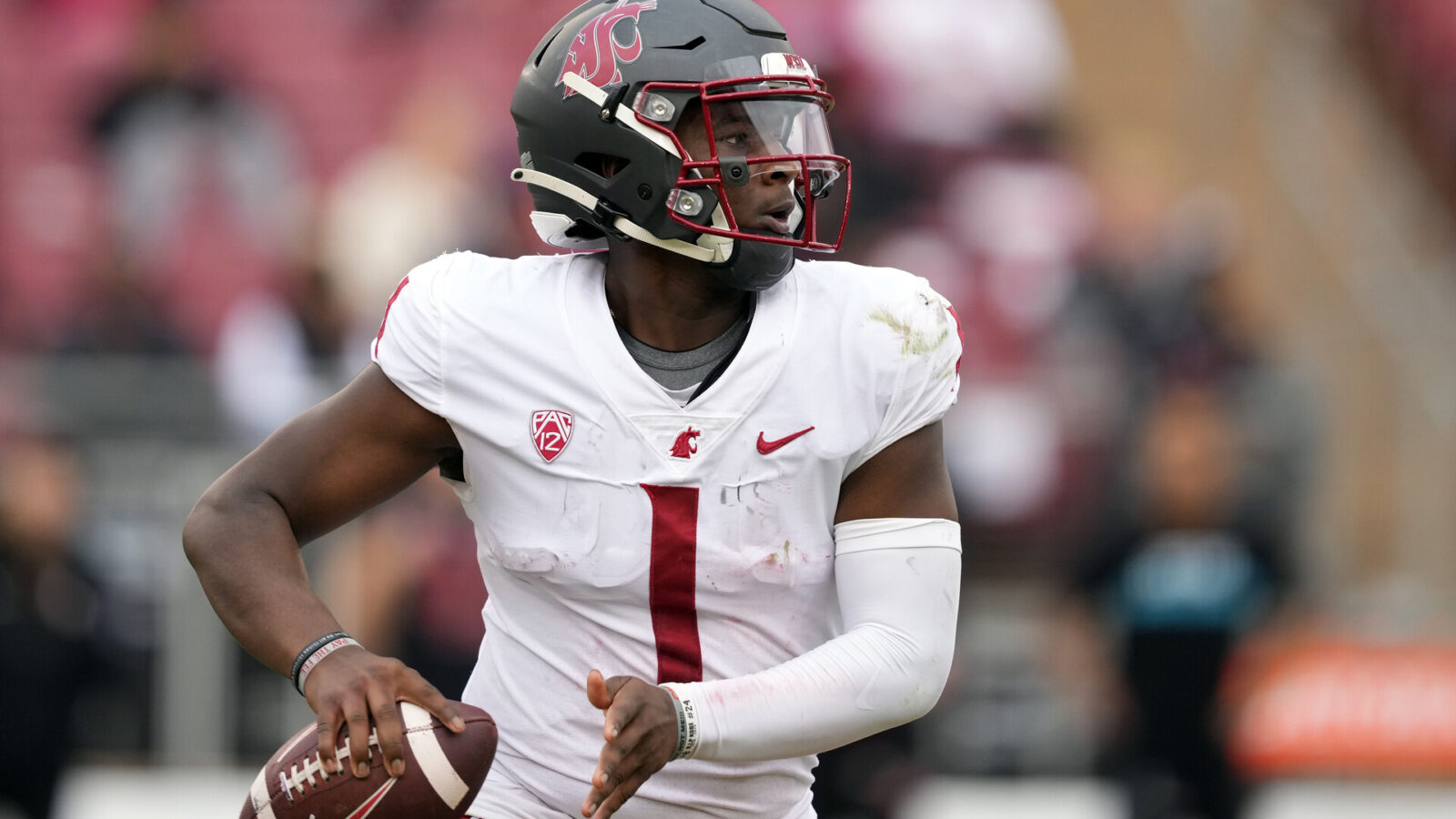 Washington State Cougars quarterback Cameron Ward (1) looks to pass against the Stanford Cardinal during the third quarter at Stanford Stadium.