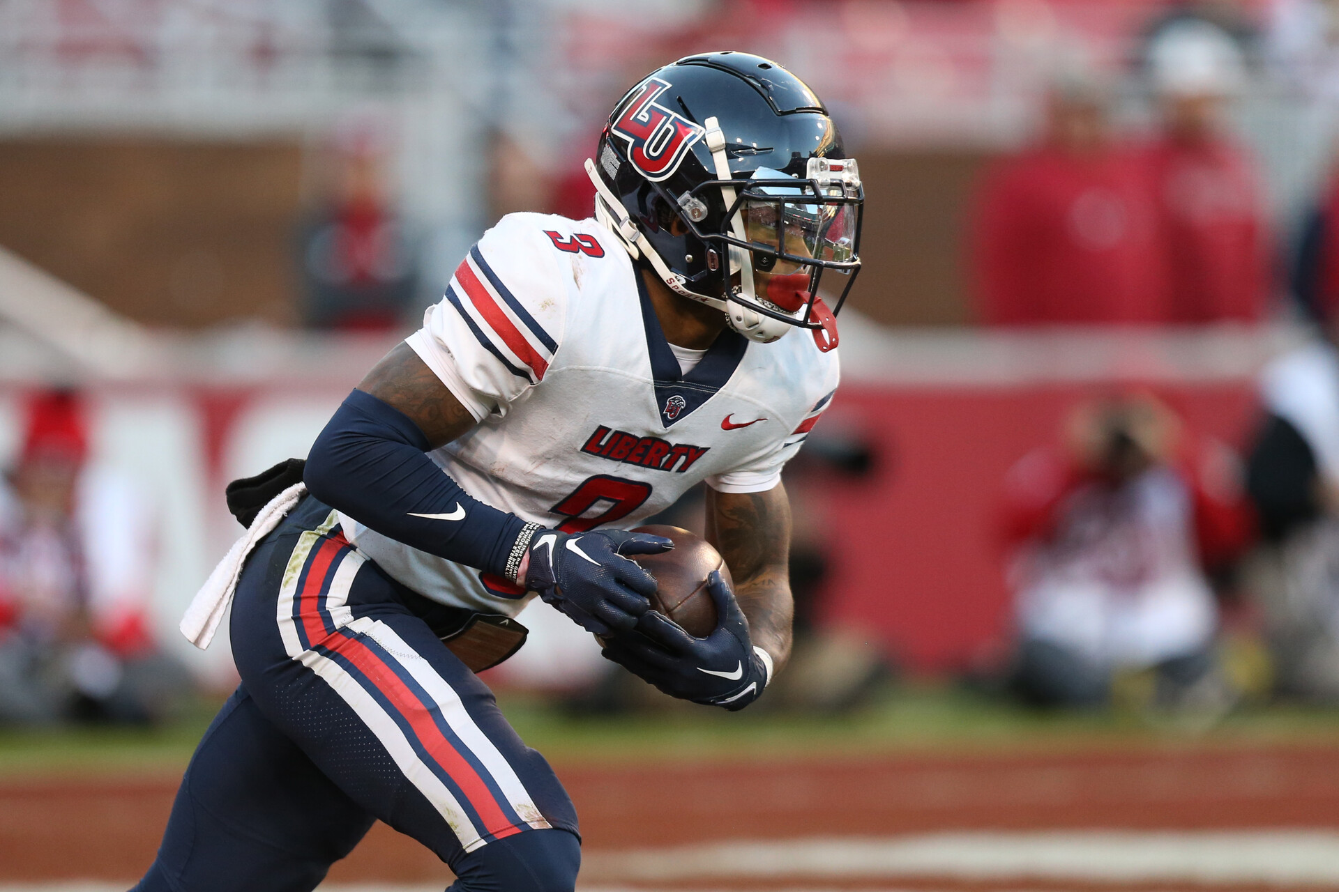 Liberty Flames wide receiver Demario Douglas (3) returns a kick during the second half against the Arkansas Razorbacks at Donald W. Reynolds Razorback Stadium.