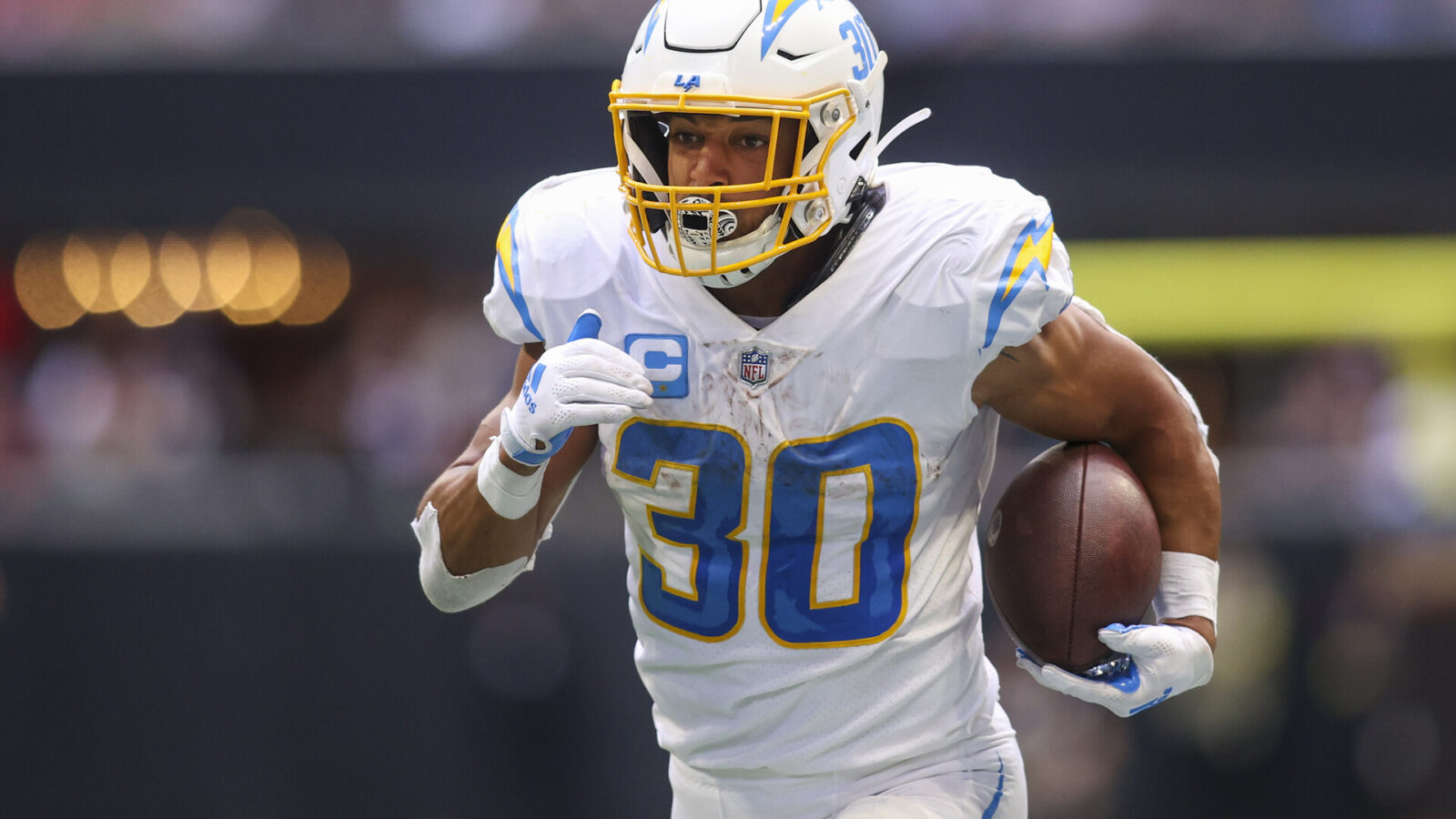 Los Angeles Chargers running back Austin Ekeler (30) runs the ball against the Atlanta Falcons in the second half at Mercedes-Benz Stadium.
