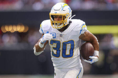 Los Angeles Chargers running back Austin Ekeler (30) runs the ball against the Atlanta Falcons in the second half at Mercedes-Benz Stadium.
