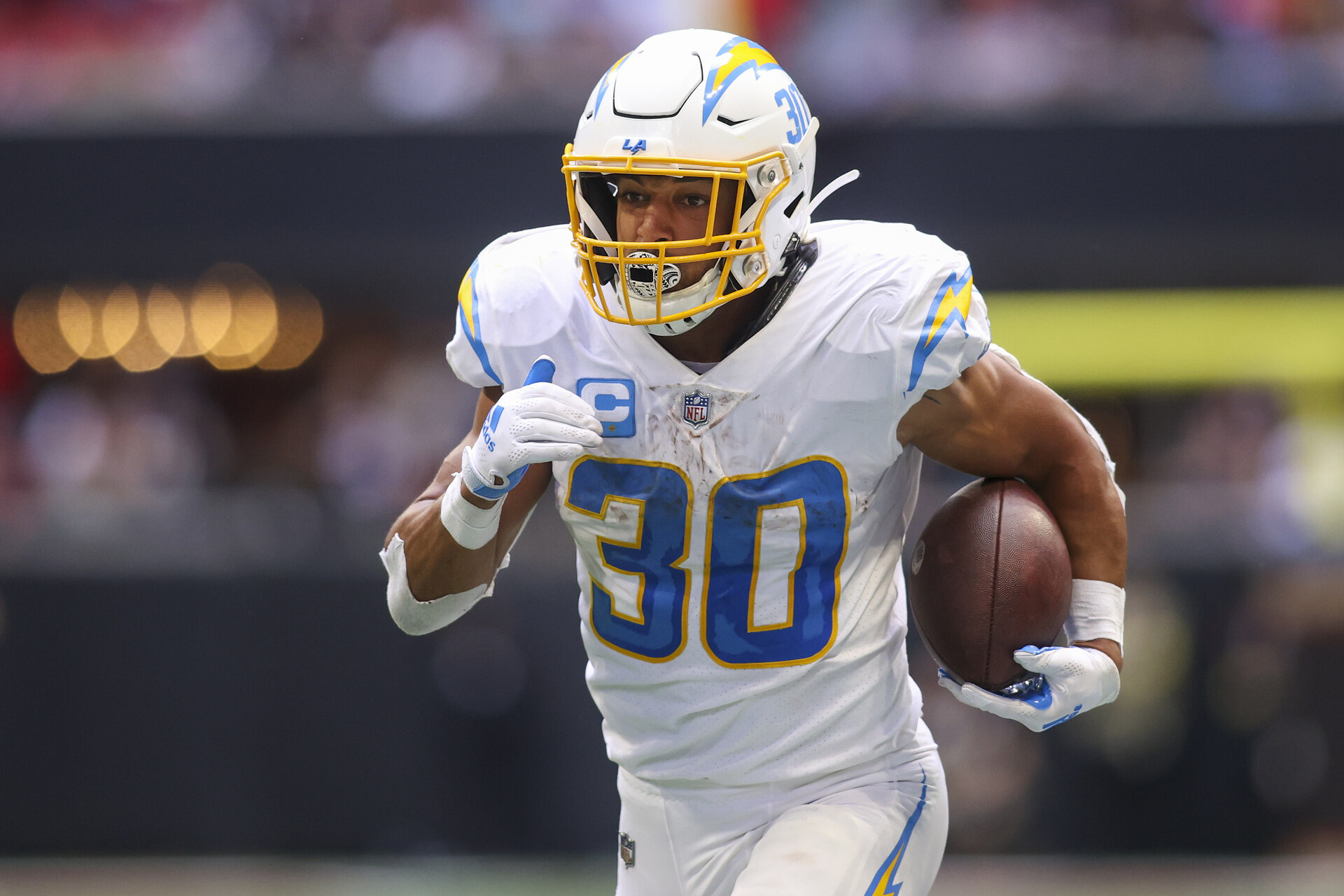 Los Angeles Chargers running back Austin Ekeler (30) runs the ball against the Atlanta Falcons in the second half at Mercedes-Benz Stadium.