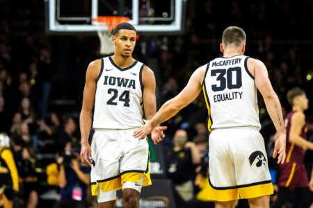 Iowa forward Kris Murray, left, high-fives guard Connor McCaffery during a NCAA men's basketball game against Bethune-Cookman, Monday, Nov. 7, 2022, at Carver-Hawkeye Arena in Iowa City, Iowa.