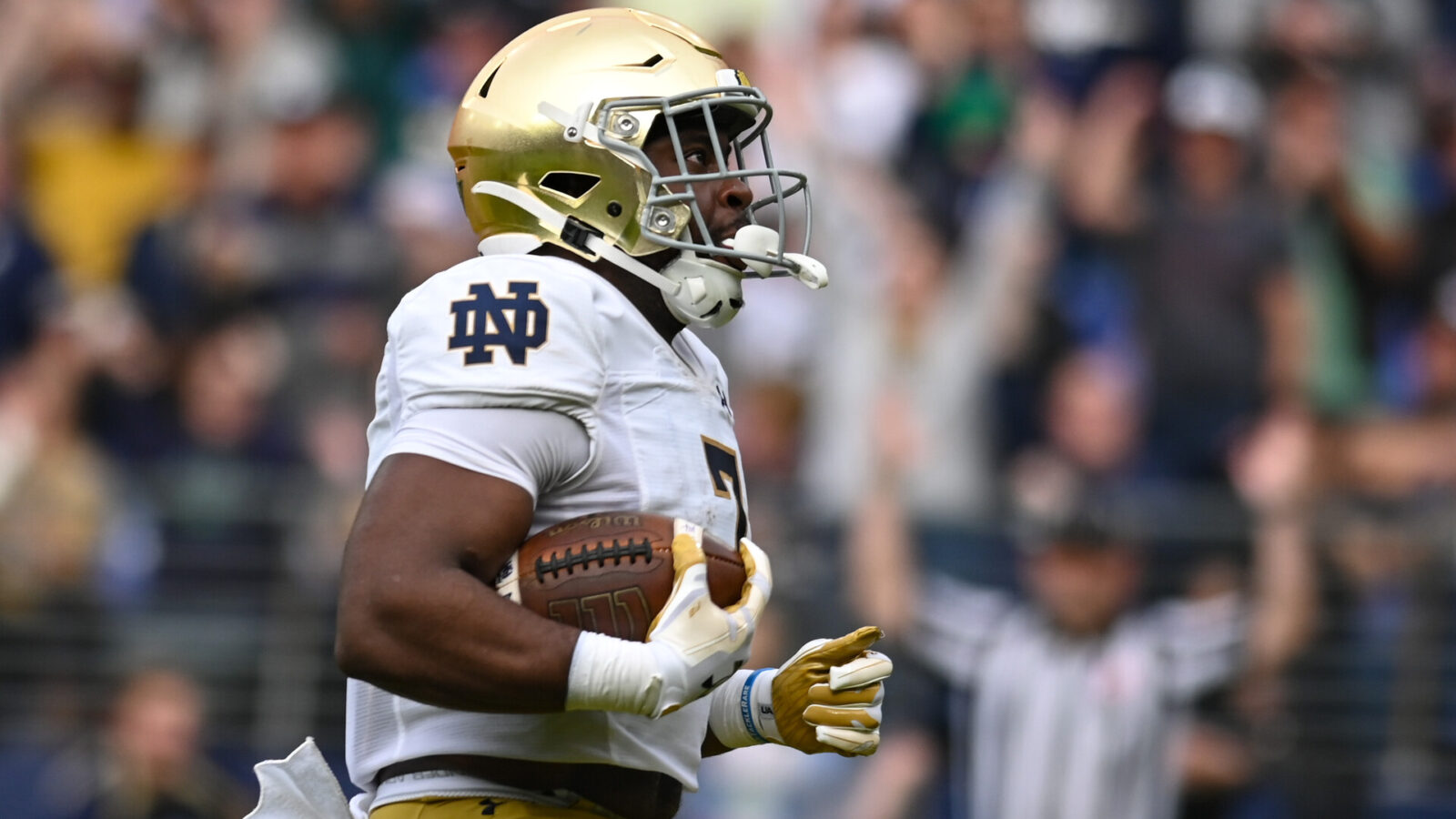 Notre Dame Fighting Irish running back Audric Estime (7) reacts after scoring a first quarter touchdown against the Navy Midshipmen at M&T Bank Stadium.