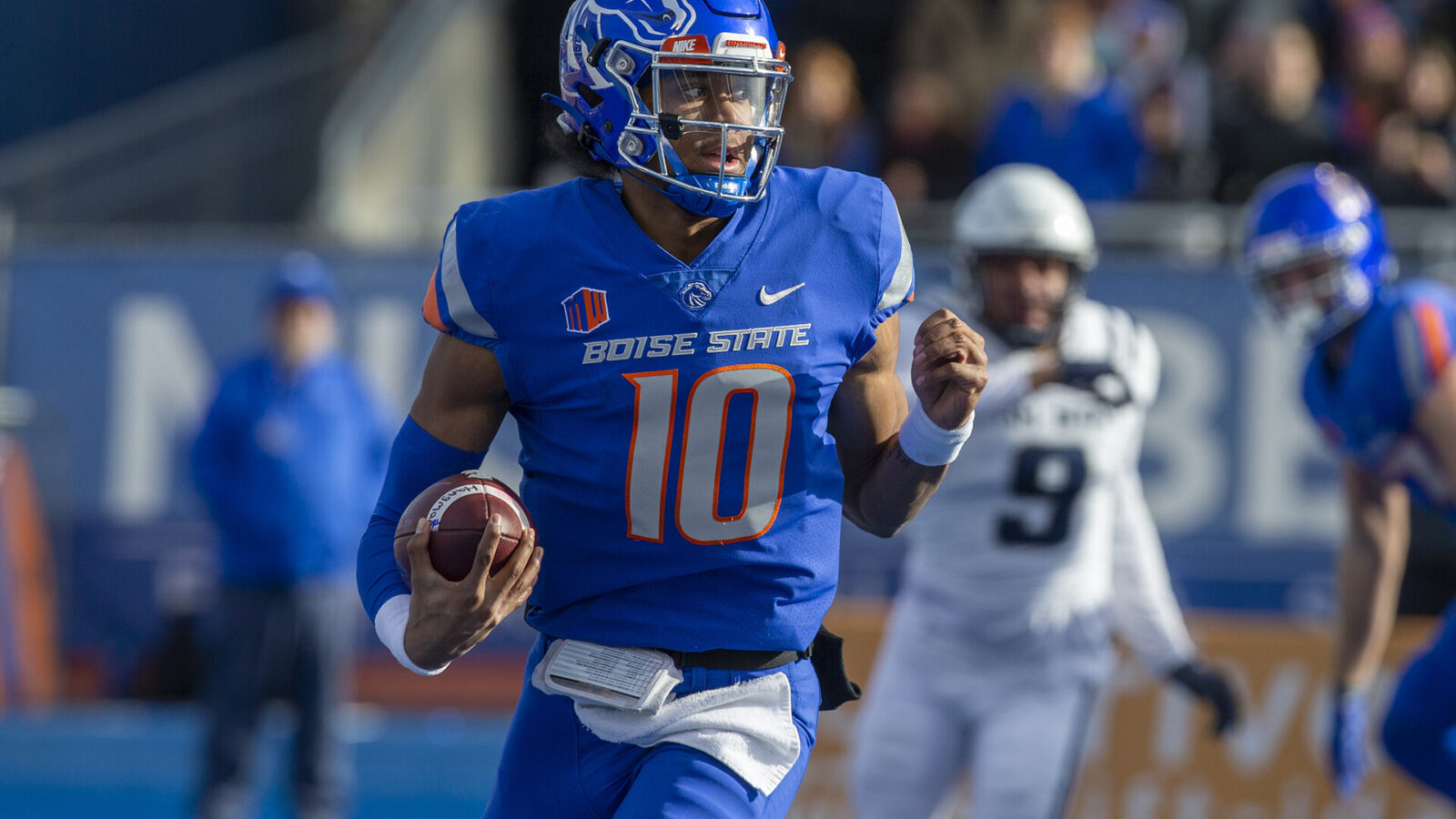 Boise State Broncos quarterback Taylen Green (10) scrambles during first half action against the Utah State Aggies at Albertsons Stadium.