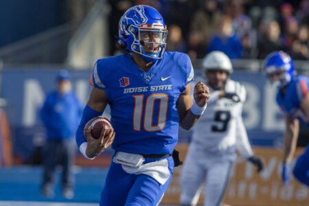 Boise State Broncos quarterback Taylen Green (10) scrambles during first half action against the Utah State Aggies at Albertsons Stadium.