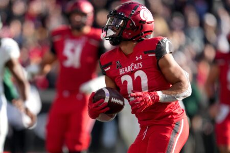 Cincinnati Bearcats running back Ryan Montgomery (22) runs for a touchdown in the third quarter during a college football game against the Tulane Green Wave, Friday, Nov. 25, 2022, at Nippert Stadium in Cincinnati.