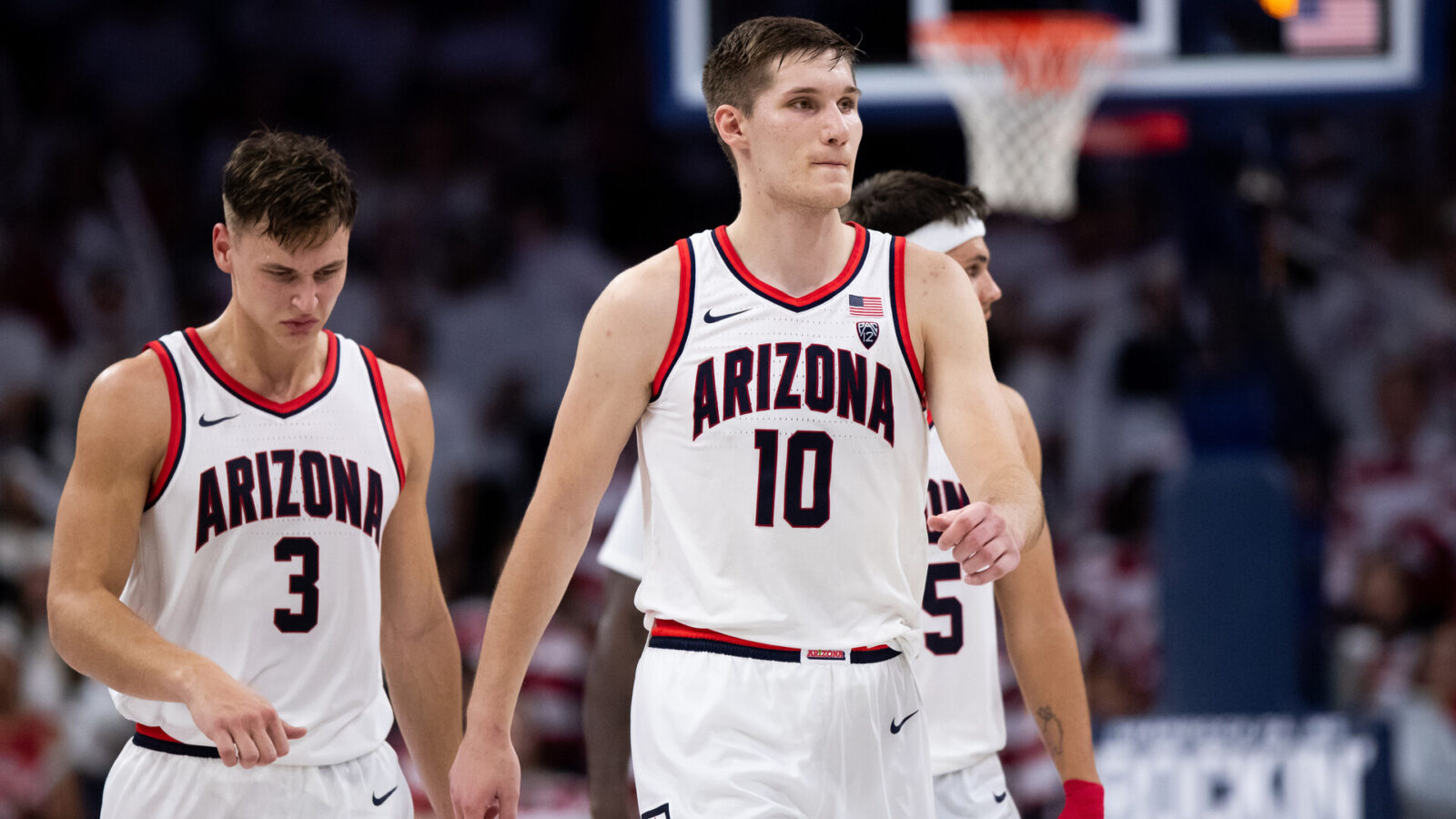 Arizona Wildcats forward Azuolas Tubelis (10), guard Pelle Larsson (3), and guard Kerr Kriisa (25) walk back to the bench during the second half against the Cal Golden Bears at McKale Center.