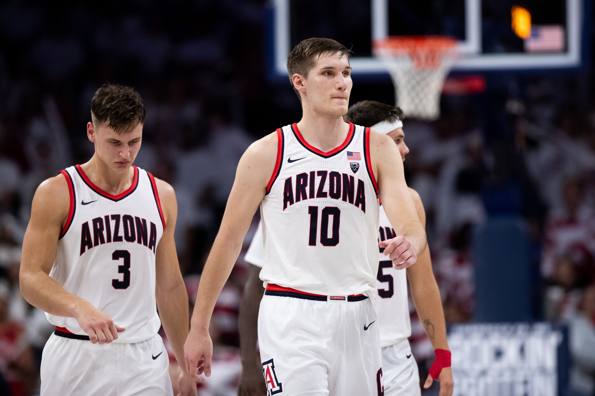 Arizona Wildcats forward Azuolas Tubelis (10), guard Pelle Larsson (3), and guard Kerr Kriisa (25) walk back to the bench during the second half against the Cal Golden Bears at McKale Center.