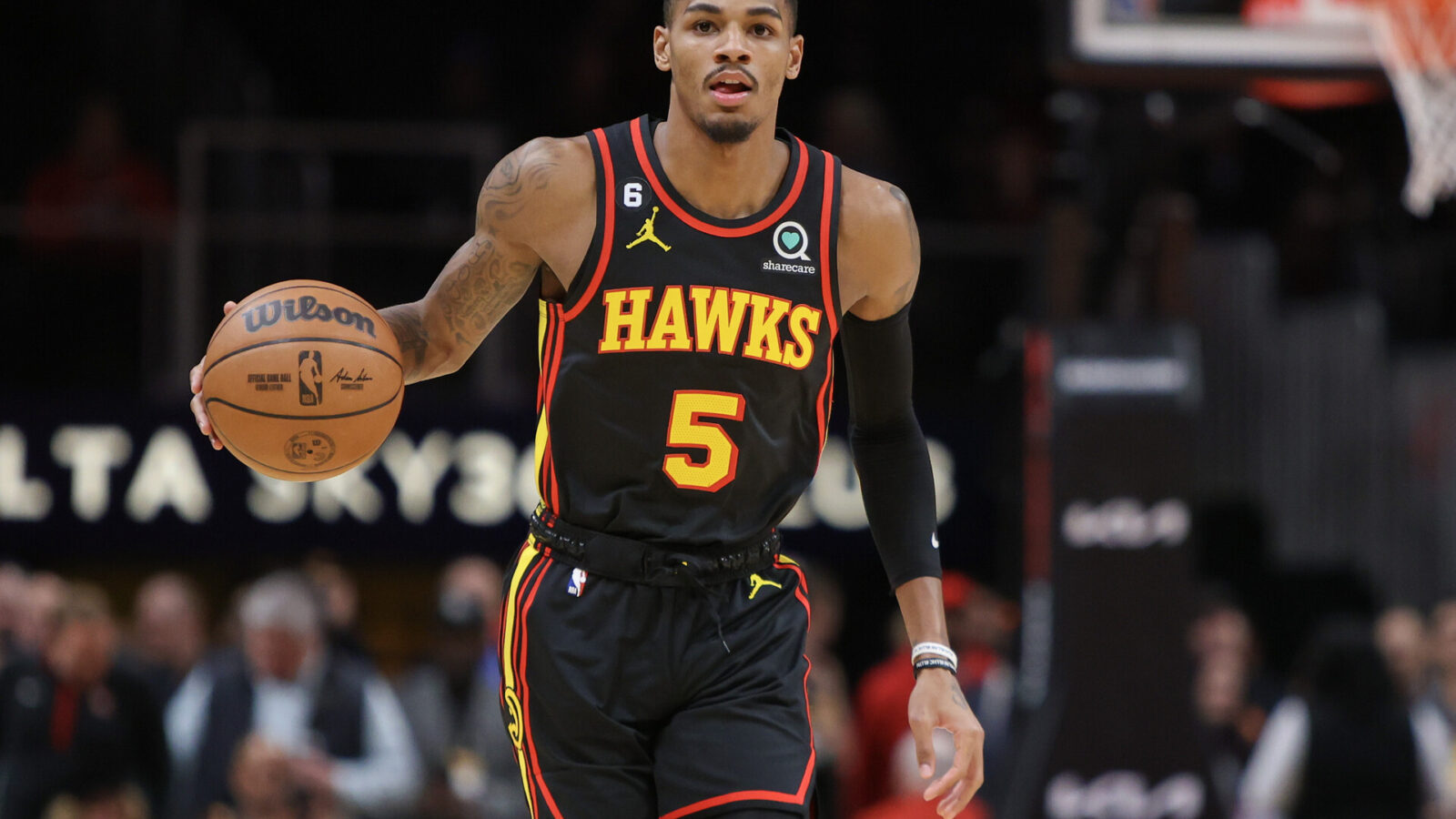 Atlanta Hawks guard Dejounte Murray (5) dribbles against the Oklahoma City Thunder in the first quarter at State Farm Arena.