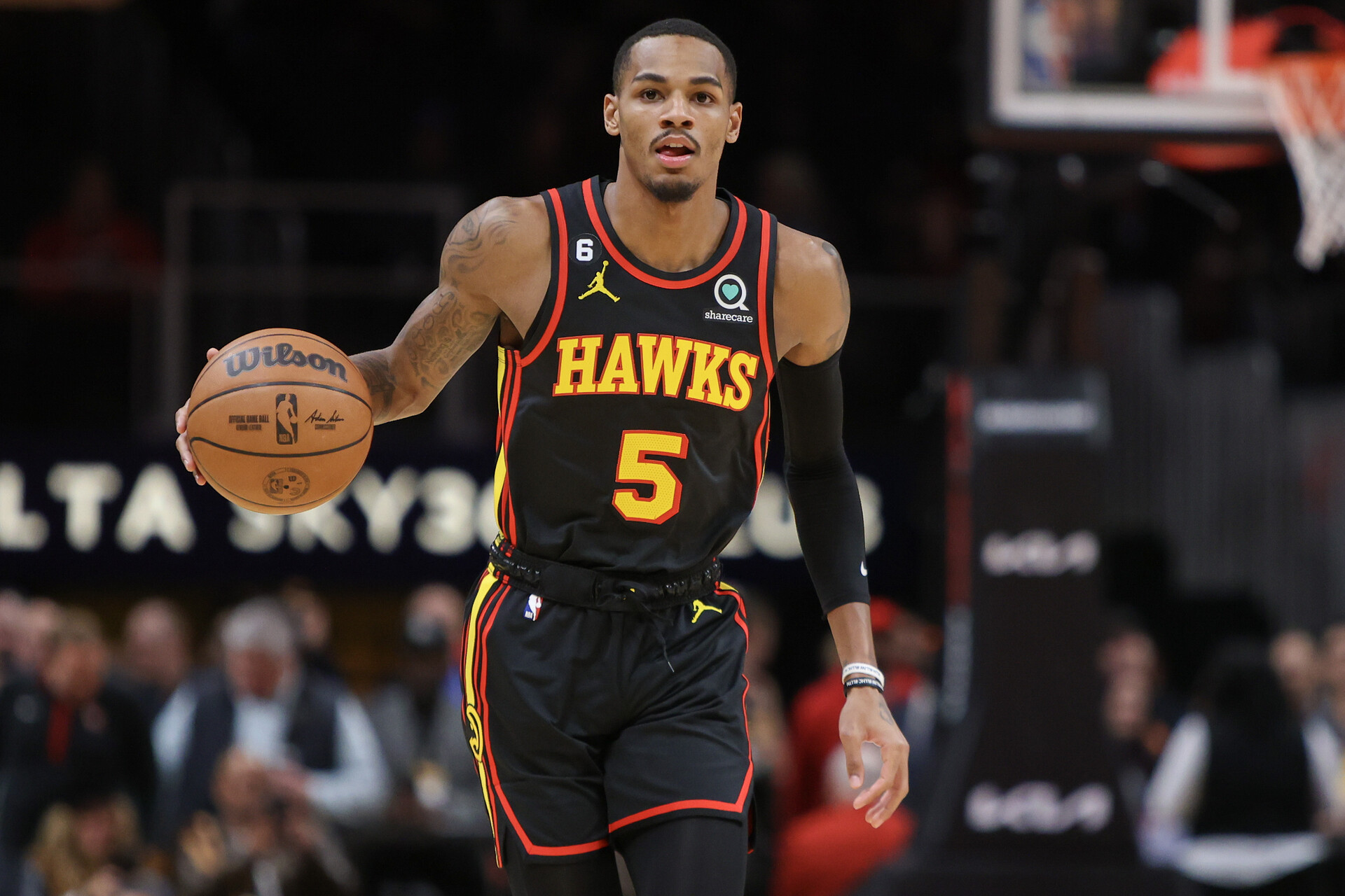 Atlanta Hawks guard Dejounte Murray (5) dribbles against the Oklahoma City Thunder in the first quarter at State Farm Arena.