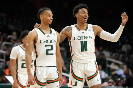 CORAL GABLES, FLORIDA - NOVEMBER 15: Isaiah Wong #2 and Jordan Miller #11 of the Miami (Fl) Hurricanes talk on the court during the first half against the Florida A&M Rattlers at Watsco Center on November 15, 2022 in Coral Gables, Florida.