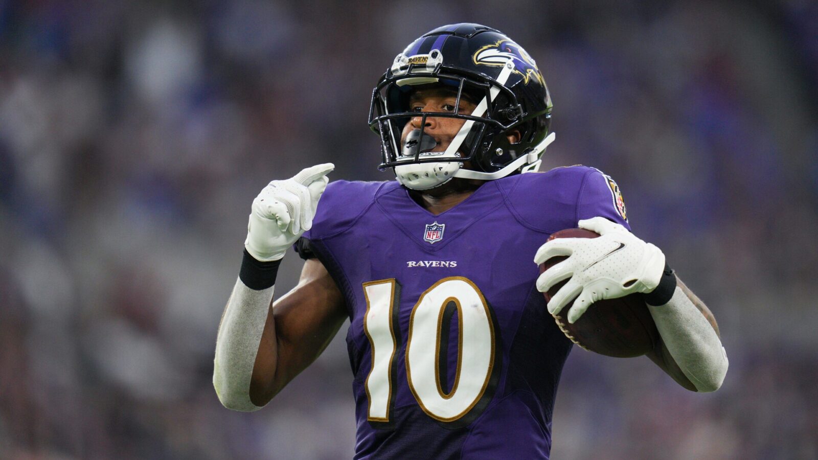 Baltimore Ravens wide receiver Demarcus Robinson (10) runs to the end zone for a touchdown after catching the ball against the Washington Commanders in the second quarter at M&T Bank Stadium.