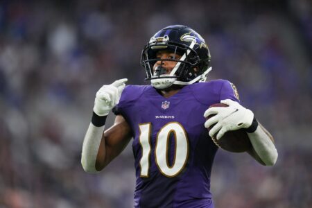 Baltimore Ravens wide receiver Demarcus Robinson (10) runs to the end zone for a touchdown after catching the ball against the Washington Commanders in the second quarter at M&T Bank Stadium.