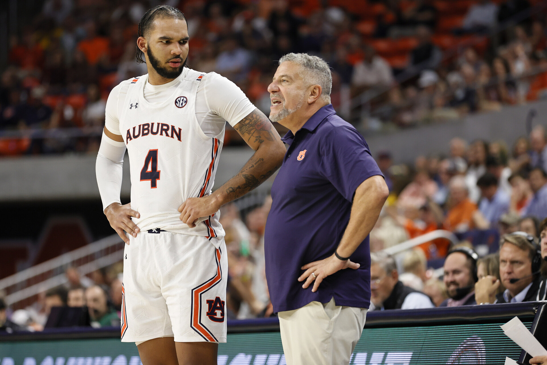 Auburn Tigers forward Johni Broome (4) talks with head coach Bruce Pearl during the second half against the George Mason Patriots at Neville Arena.