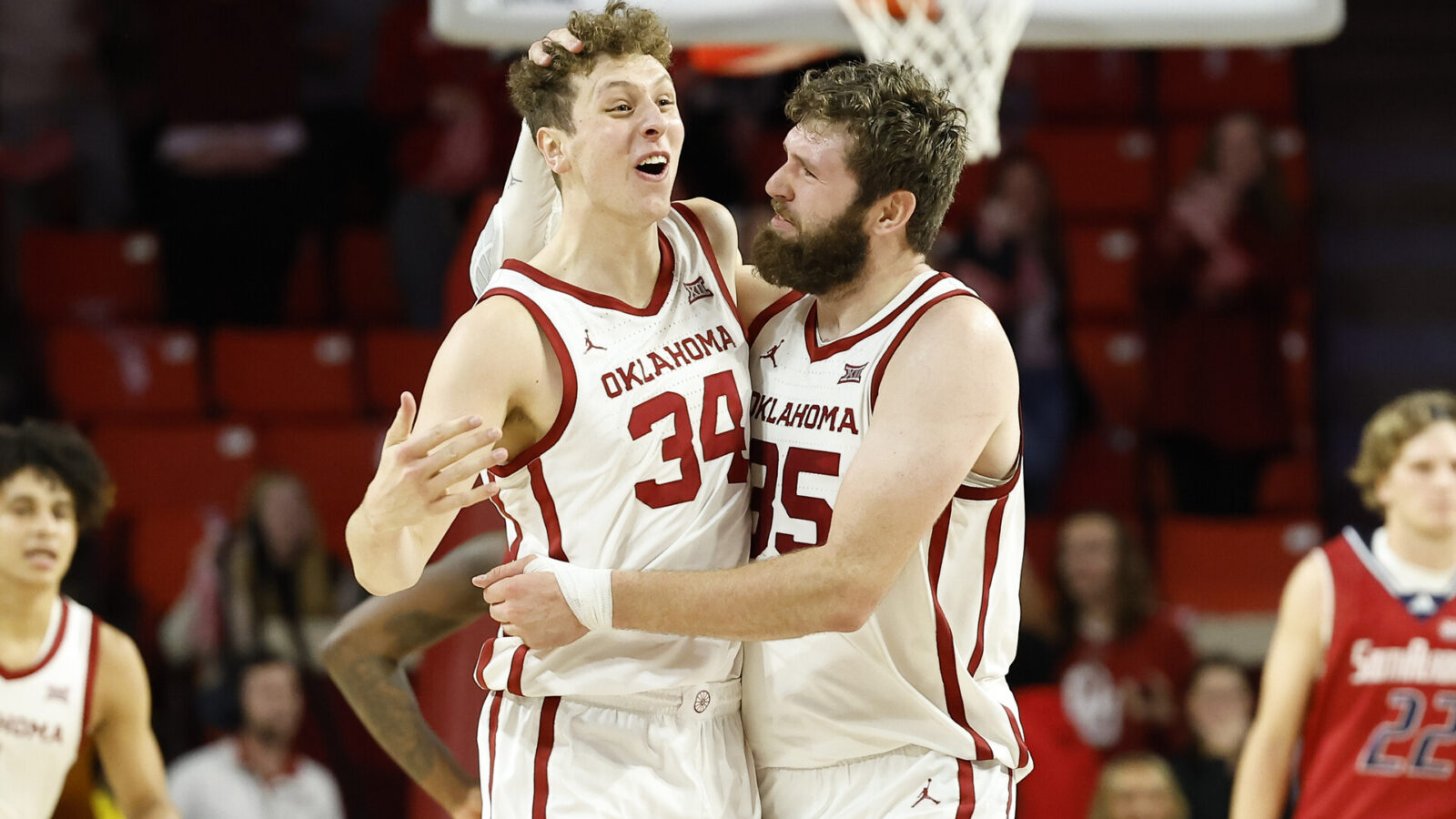 Oklahoma Sooners forward Jacob Groves (34) and forward Tanner Groves (35) celebrate after Jacob blocked a shot by South Alabama during the second half at Lloyd Noble Center. Oklahoma won 64-60.