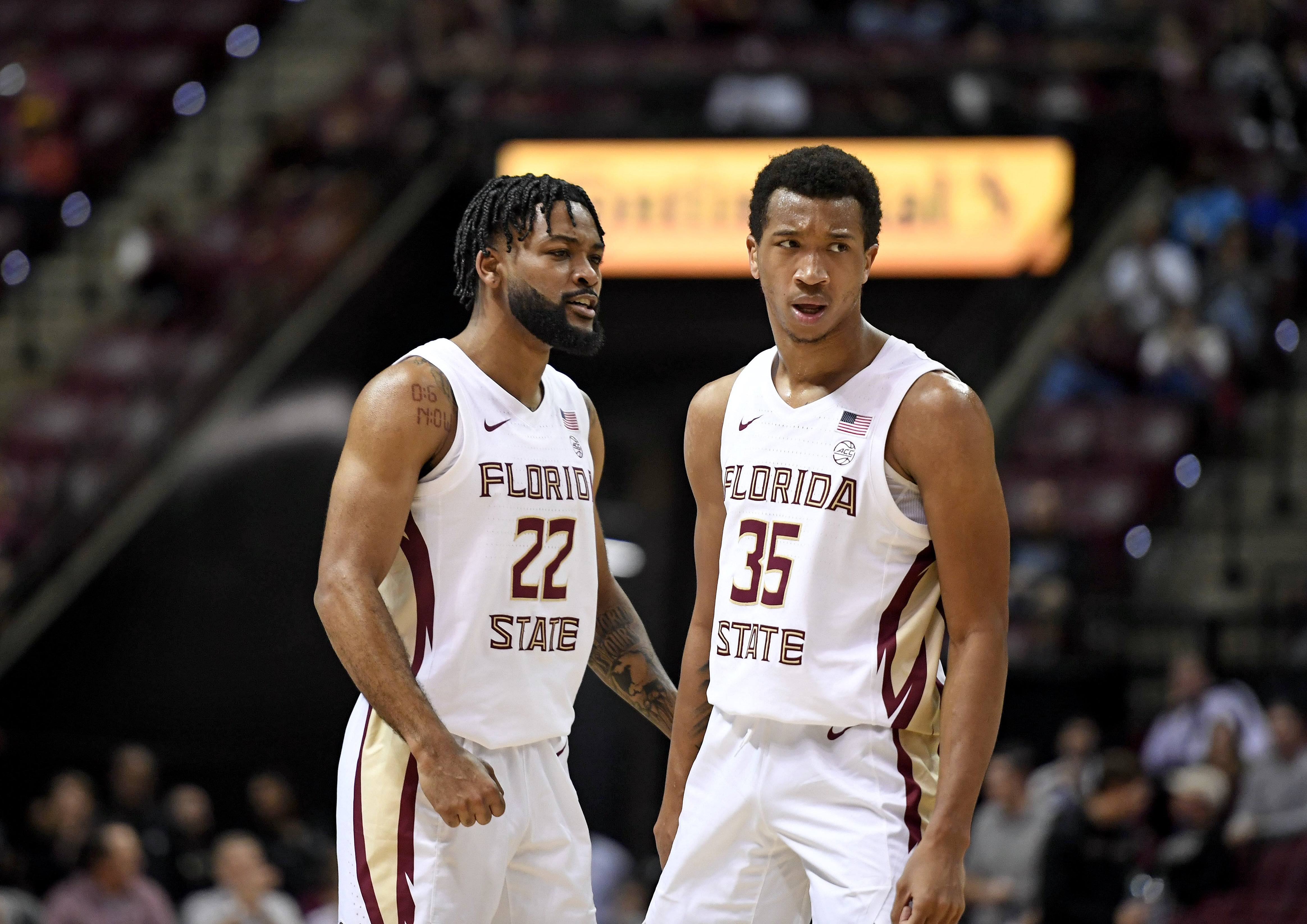 Florida State Seminoles guard Matthew Cleveland (35) and Darin Green Jr. (22) react to a play during the first half against the Purdue Boilermakers at Donald L. Tucker Center.