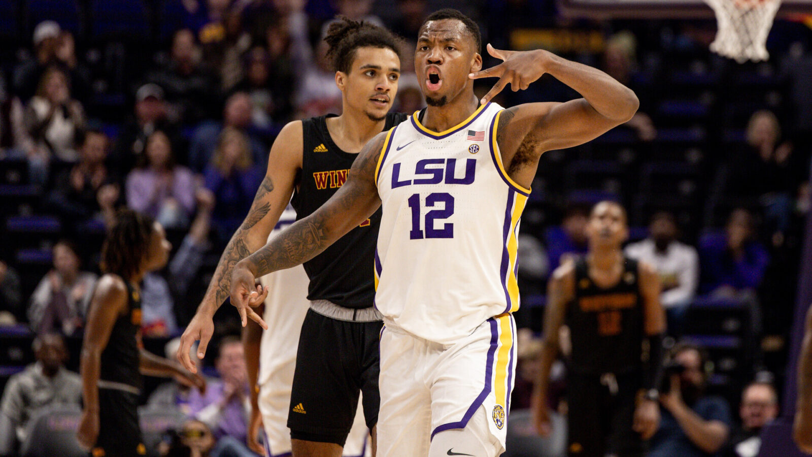 LSU Tigers forward KJ Williams (12) reacts to making a three point basket in the final minute of the game against the Winthrop Eagles during the second half at Pete Maravich Assembly Center.