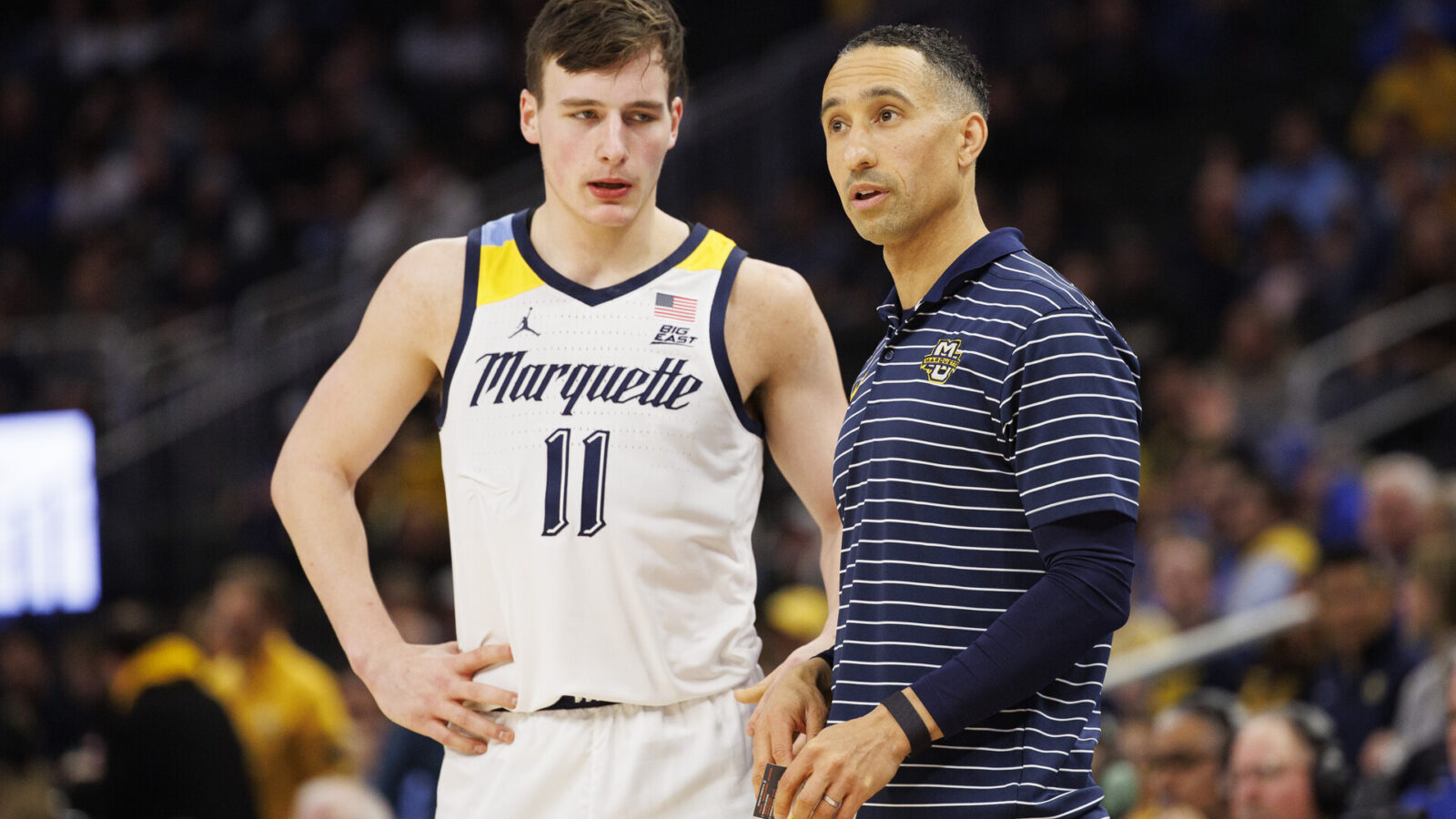 Marquette Golden Eagles head coach Shaka Smart talks with guard Tyler Kolek (11) during the game against the Creighton Bluejays at Fiserv Forum.