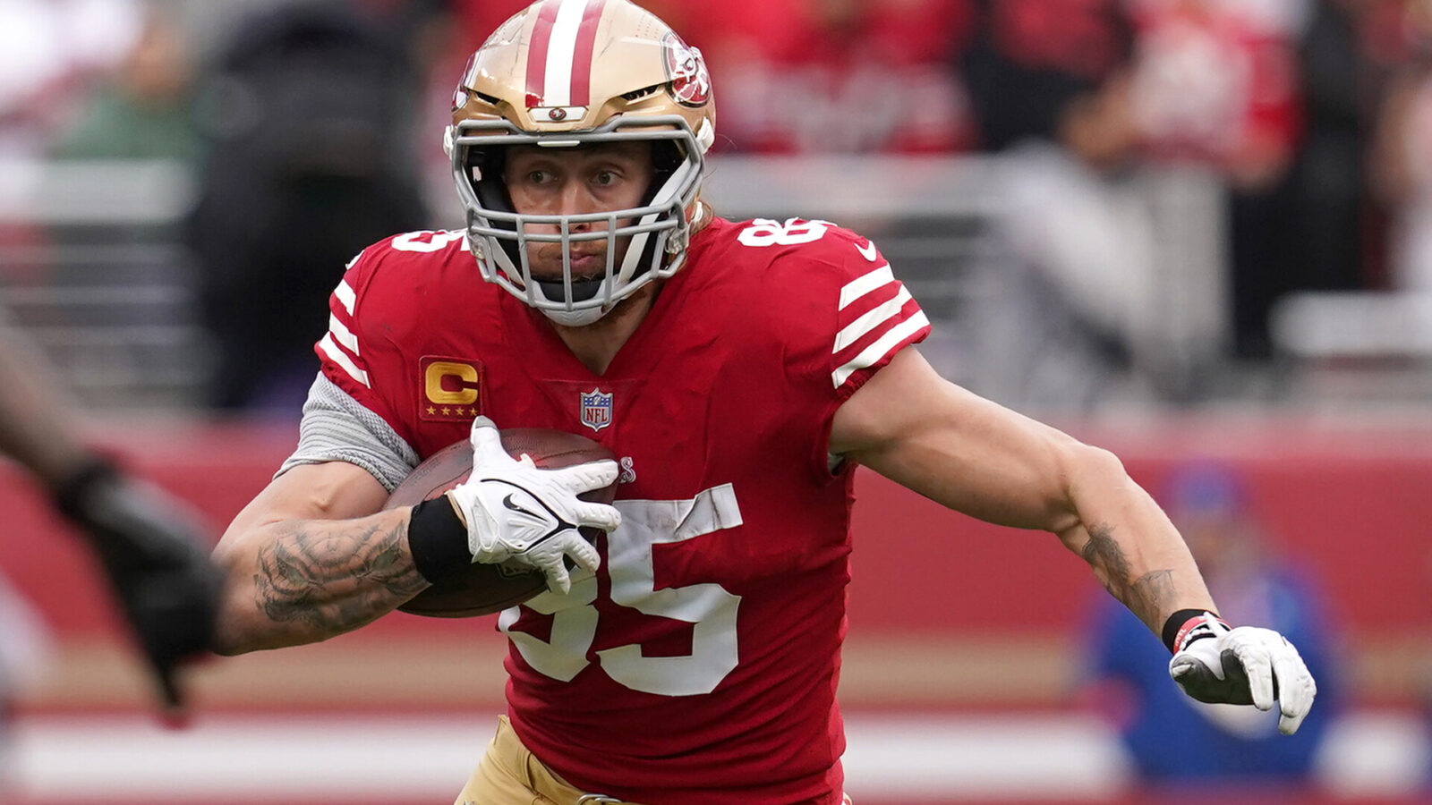 Jan 14, 2023; Santa Clara, California, USA; San Francisco 49ers tight end George Kittle (85) runs after a catch against the Seattle Seahawks in the second quarter during a wild card game at Levi's Stadium.