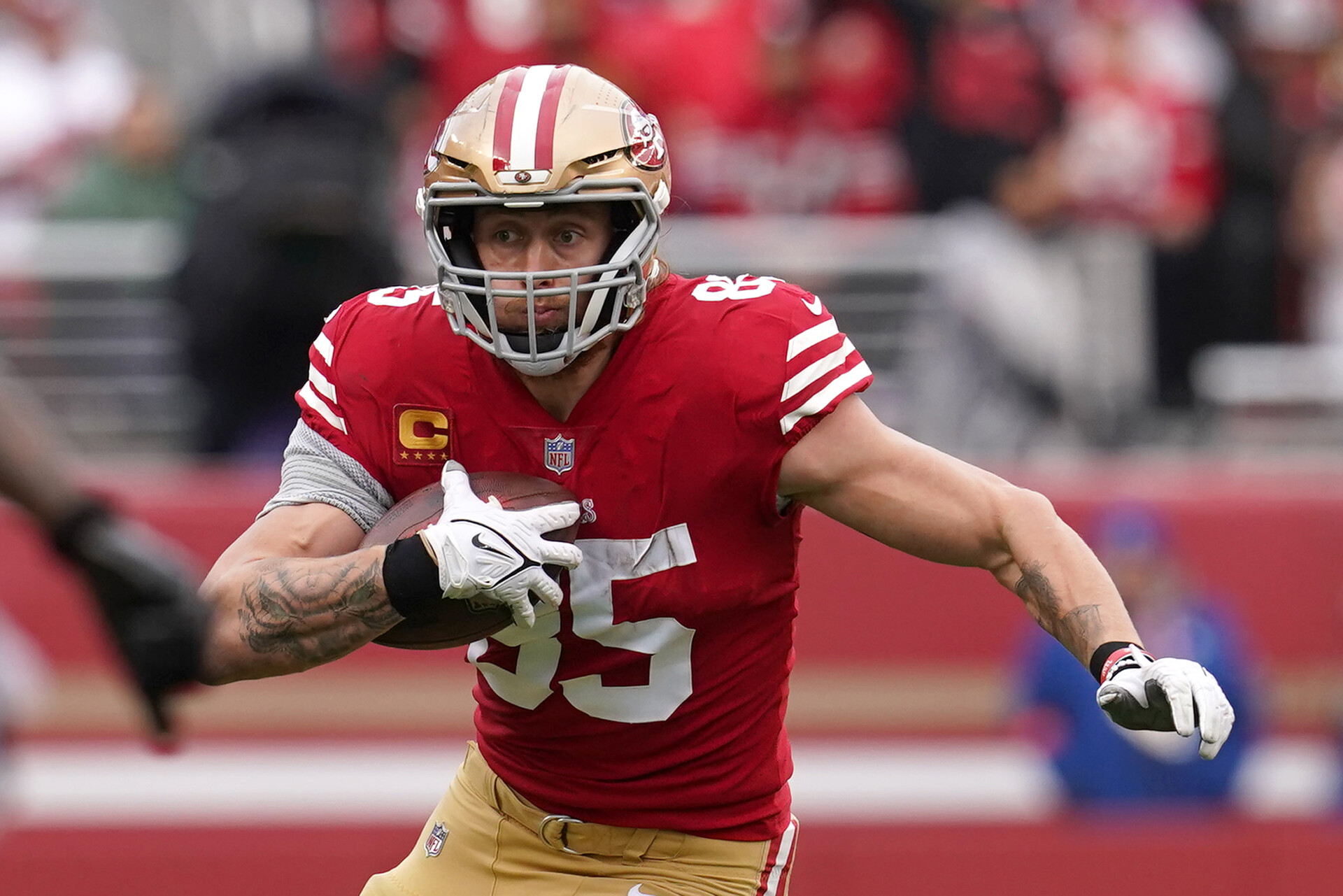 Jan 14, 2023; Santa Clara, California, USA; San Francisco 49ers tight end George Kittle (85) runs after a catch against the Seattle Seahawks in the second quarter during a wild card game at Levi's Stadium.
