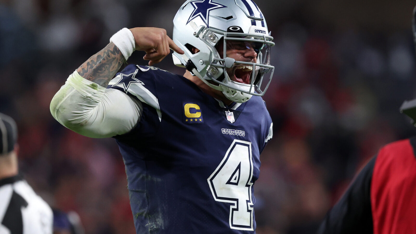 Jan 16, 2023; Tampa, Florida, USA; Dallas Cowboys quarterback Dak Prescott (4) reacts after throwing a touchdown pass against the Tampa Bay Buccaneers in the second half during the wild card game at Raymond James Stadium.