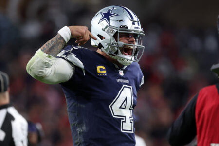Jan 16, 2023; Tampa, Florida, USA; Dallas Cowboys quarterback Dak Prescott (4) reacts after throwing a touchdown pass against the Tampa Bay Buccaneers in the second half during the wild card game at Raymond James Stadium.