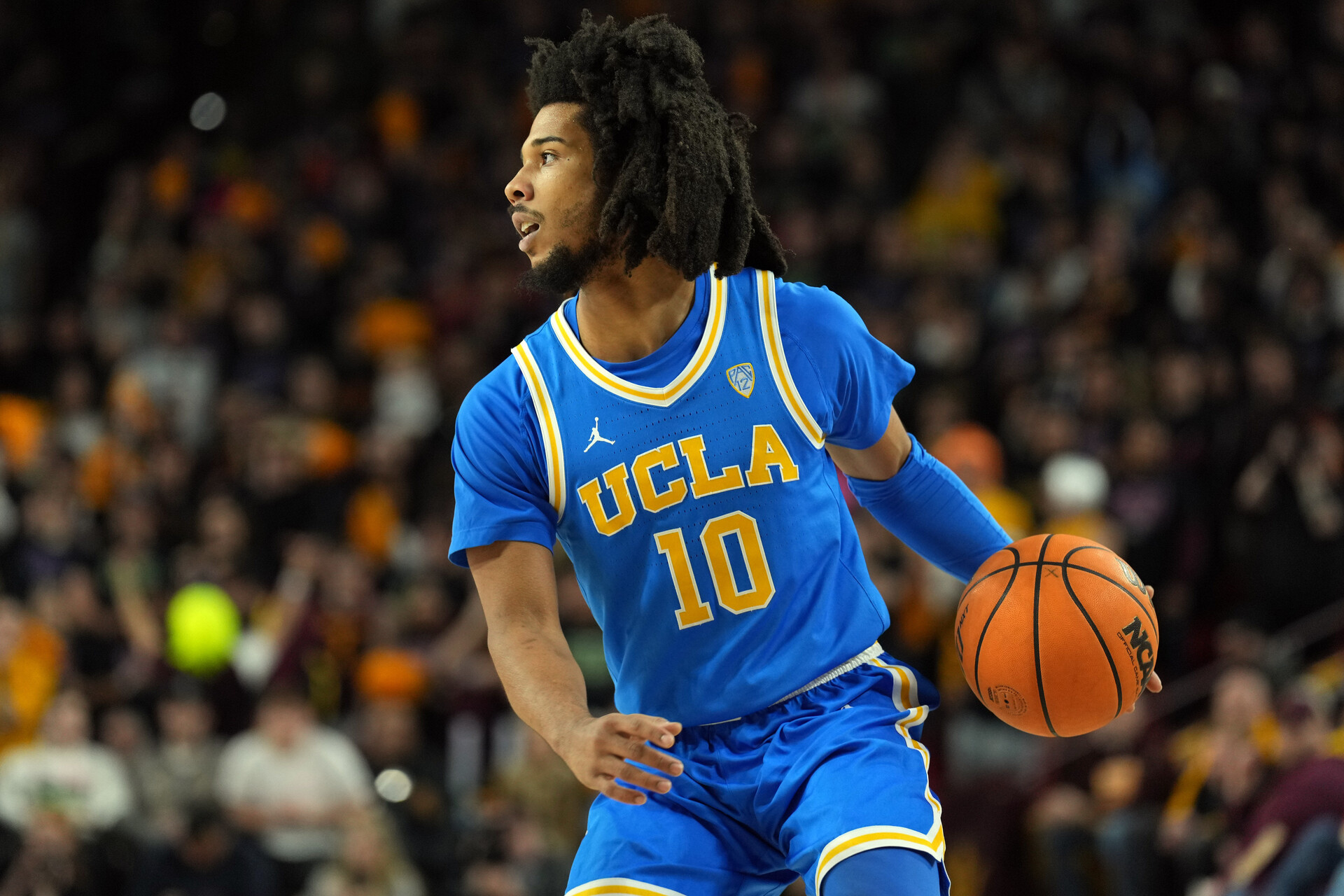 UCLA Bruins guard Tyger Campbell (10) dribbles against the Arizona State Sun Devils during the first half at Desert Financial Arena.