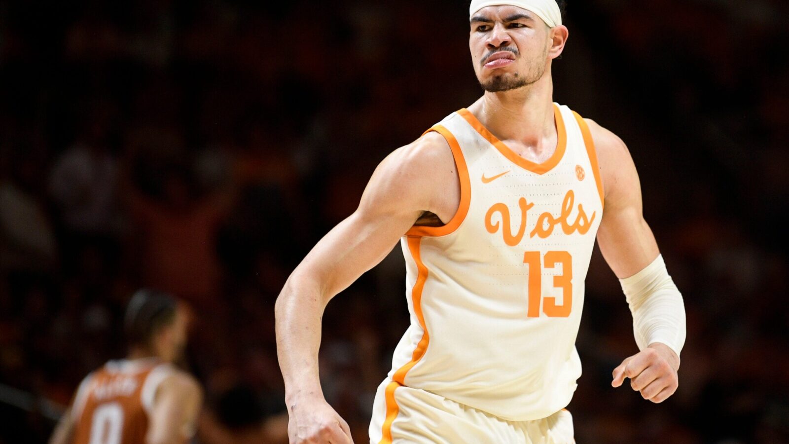 Tennessee forward Olivier Nkamhoua (13) reacts after scoring a dunk during a game between Tennessee and Texas at Thompson-Boling Arena in Knoxville, Tenn., on Saturday, Jan. 28, 2023.