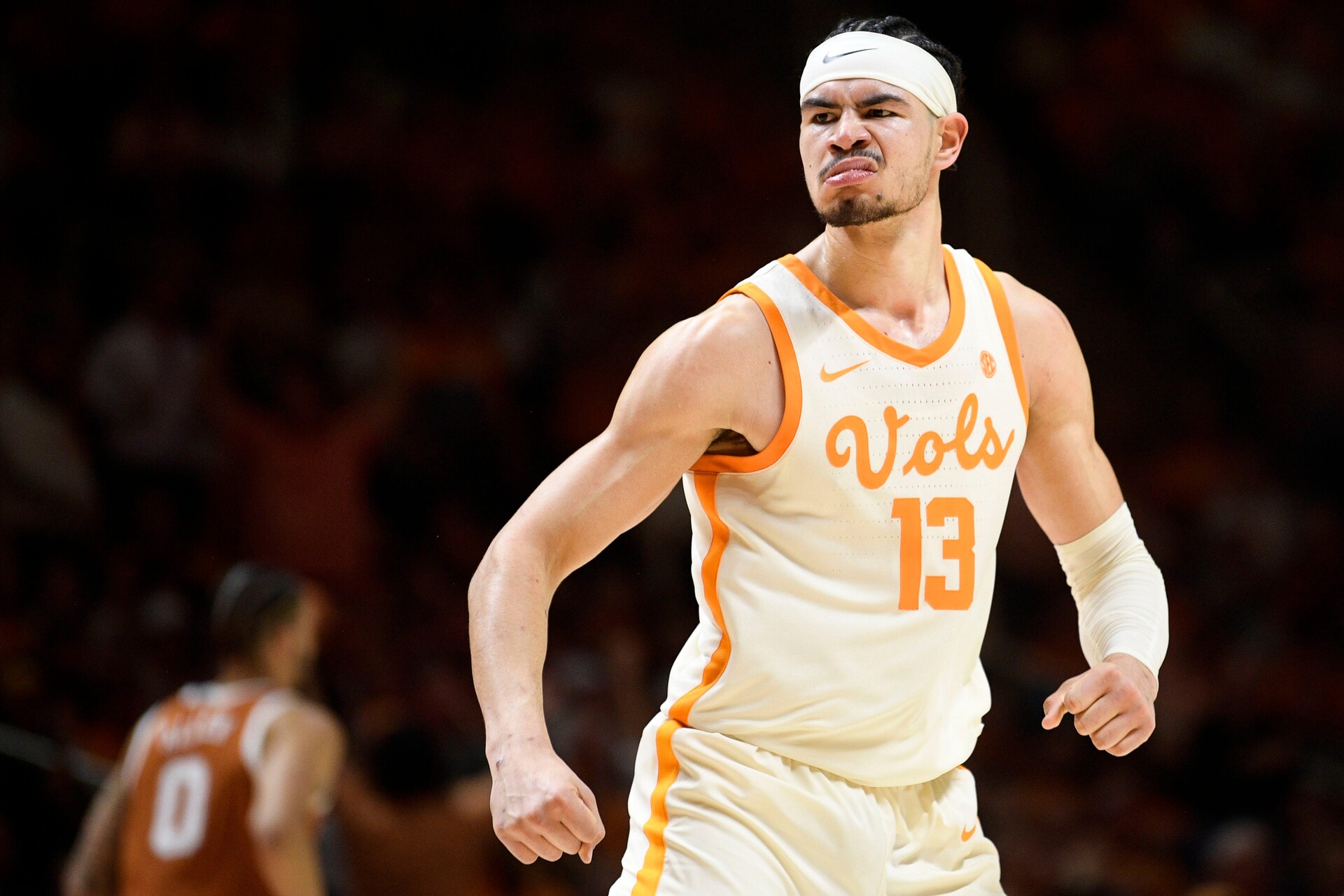 Tennessee forward Olivier Nkamhoua (13) reacts after scoring a dunk during a game between Tennessee and Texas at Thompson-Boling Arena in Knoxville, Tenn., on Saturday, Jan. 28, 2023.