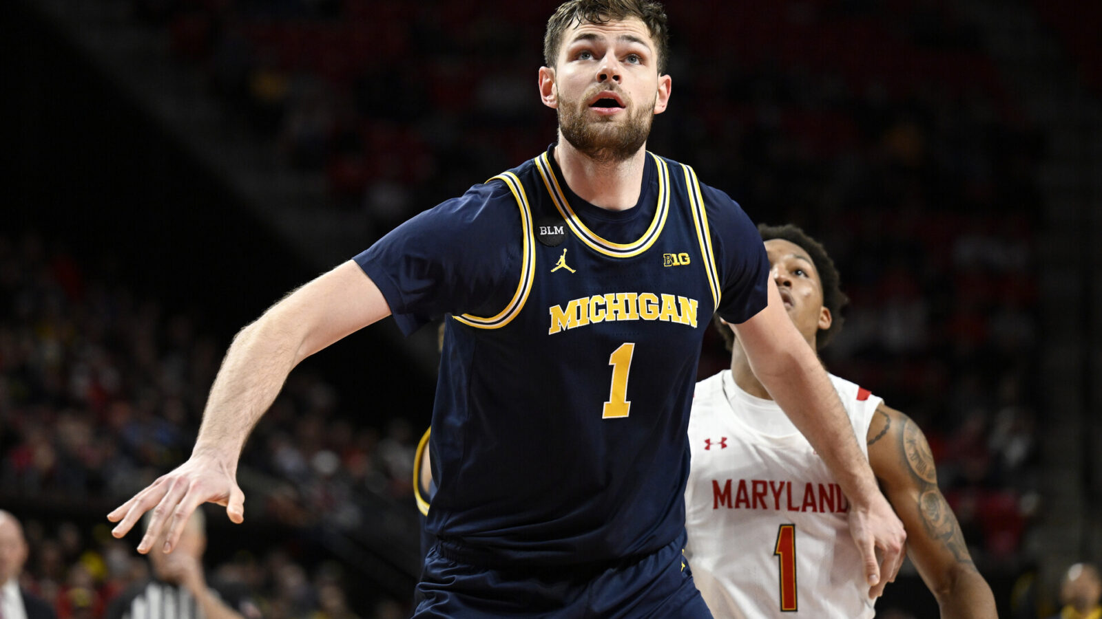 Hunter Dickinson #1 of the Michigan Wolverines boxes out against the Maryland Terrapins at Xfinity Center on January 19, 2023 in College Park, Maryland.