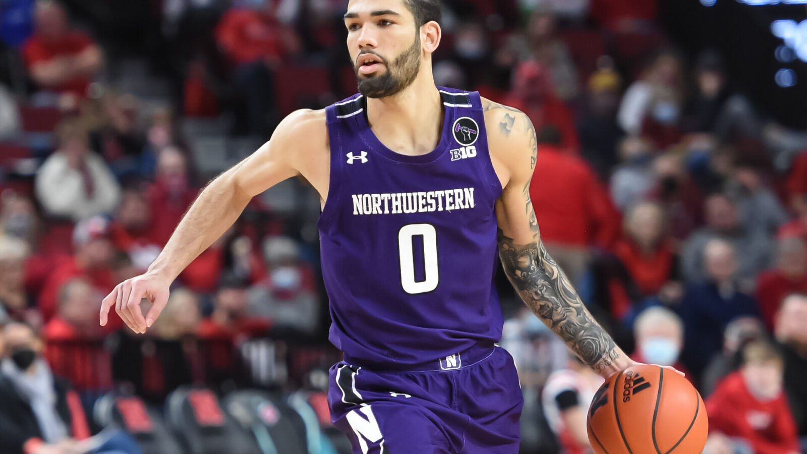 Northwestern Wildcats guard Boo Buie (0) dribbles against the Nebraska Cornhuskers in the second half at Pinnacle Bank Arena.