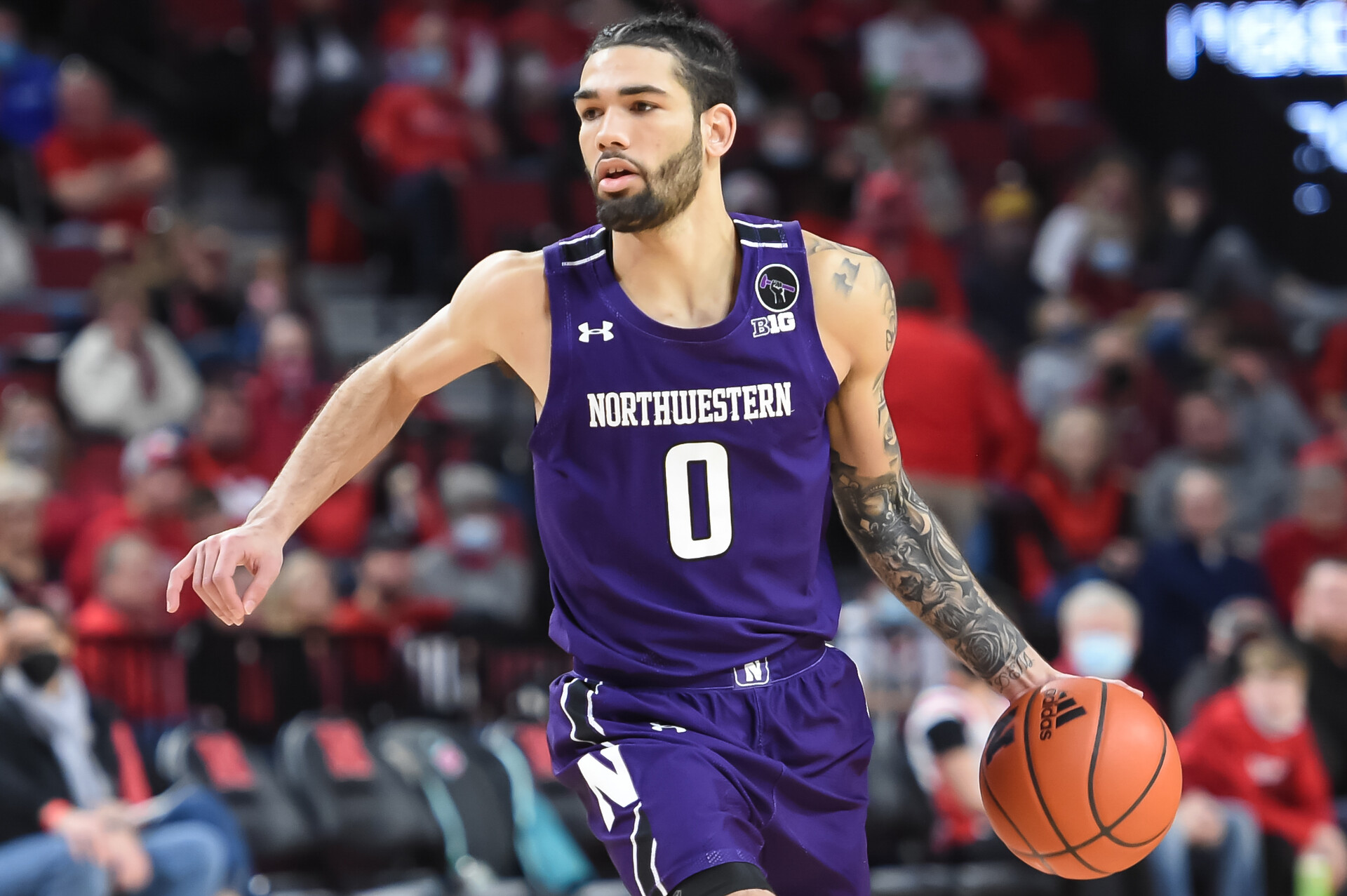 Northwestern Wildcats guard Boo Buie (0) dribbles against the Nebraska Cornhuskers in the second half at Pinnacle Bank Arena.