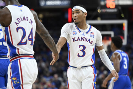 Kansas Jayhawks guard Dajuan Harris Jr. (3) high fives Kansas Jayhawks forward Jalen Wilson (10) during the first half against the Duke Blue Devils at Gainbridge Fieldhouse.