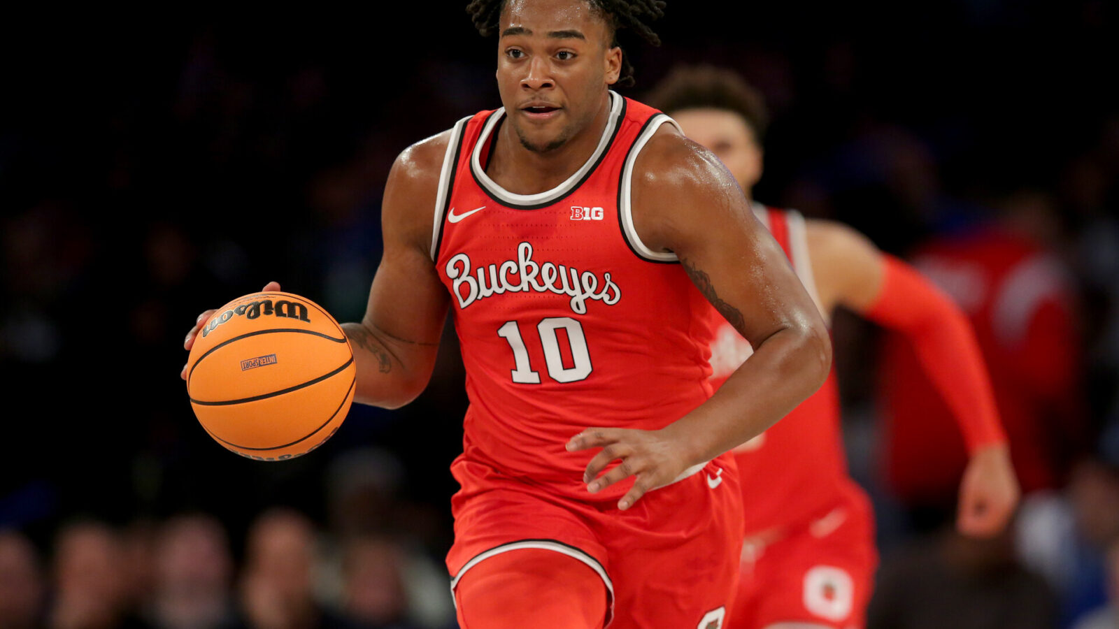 Ohio State Buckeyes forward Brice Sensabaugh (10) brings the ball up court against the North Carolina Tar Heels during the first half at Madison Square Garden.