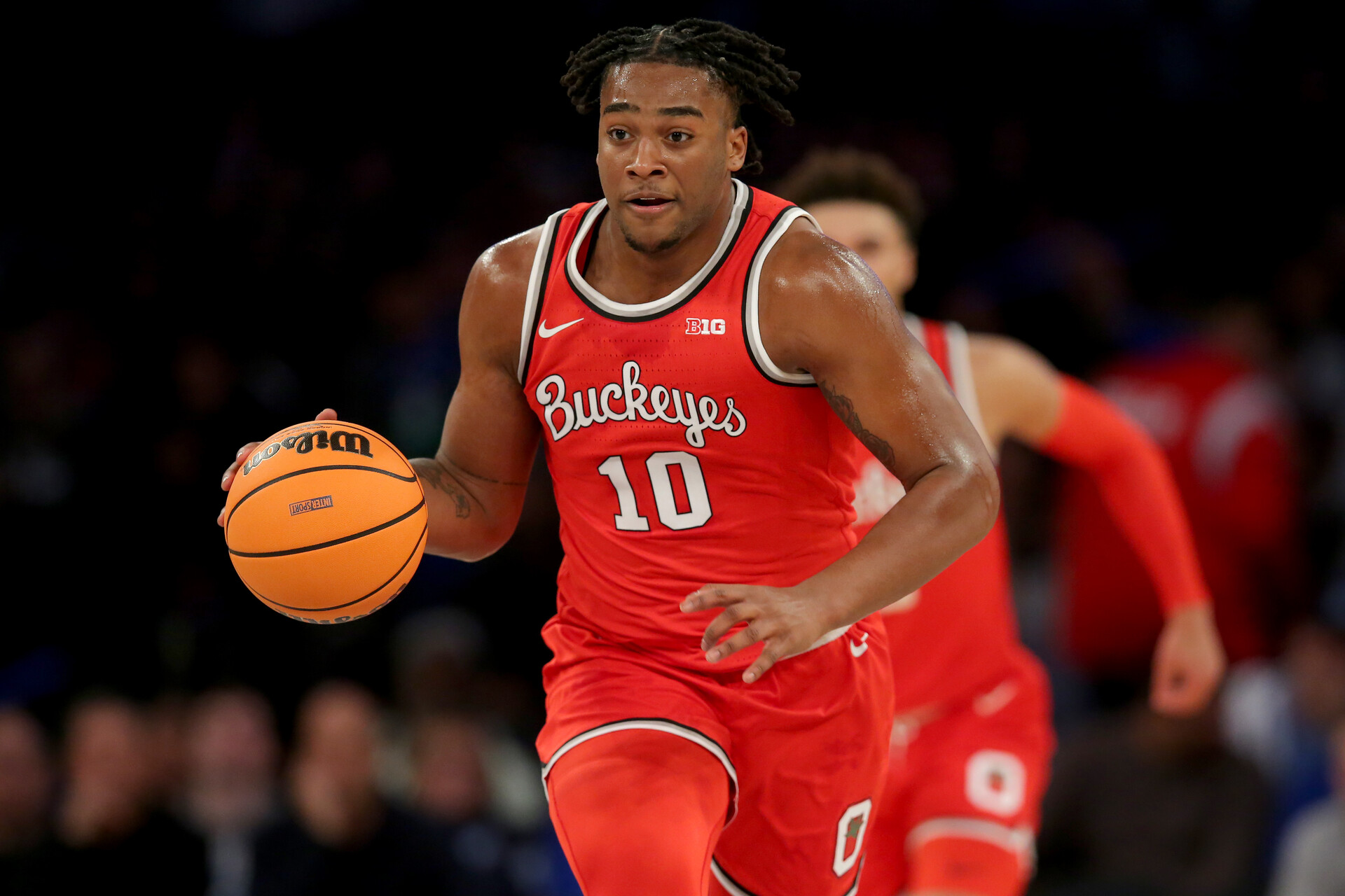 Ohio State Buckeyes forward Brice Sensabaugh (10) brings the ball up court against the North Carolina Tar Heels during the first half at Madison Square Garden.