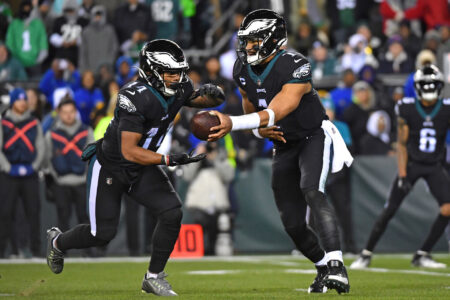 Jan 8, 2023; Philadelphia, Pennsylvania, USA; Philadelphia Eagles quarterback Jalen Hurts (1) hands the ball off to running back Kenneth Gainwell (14) against the New York Giants during the fourth quarter at Lincoln Financial Field.