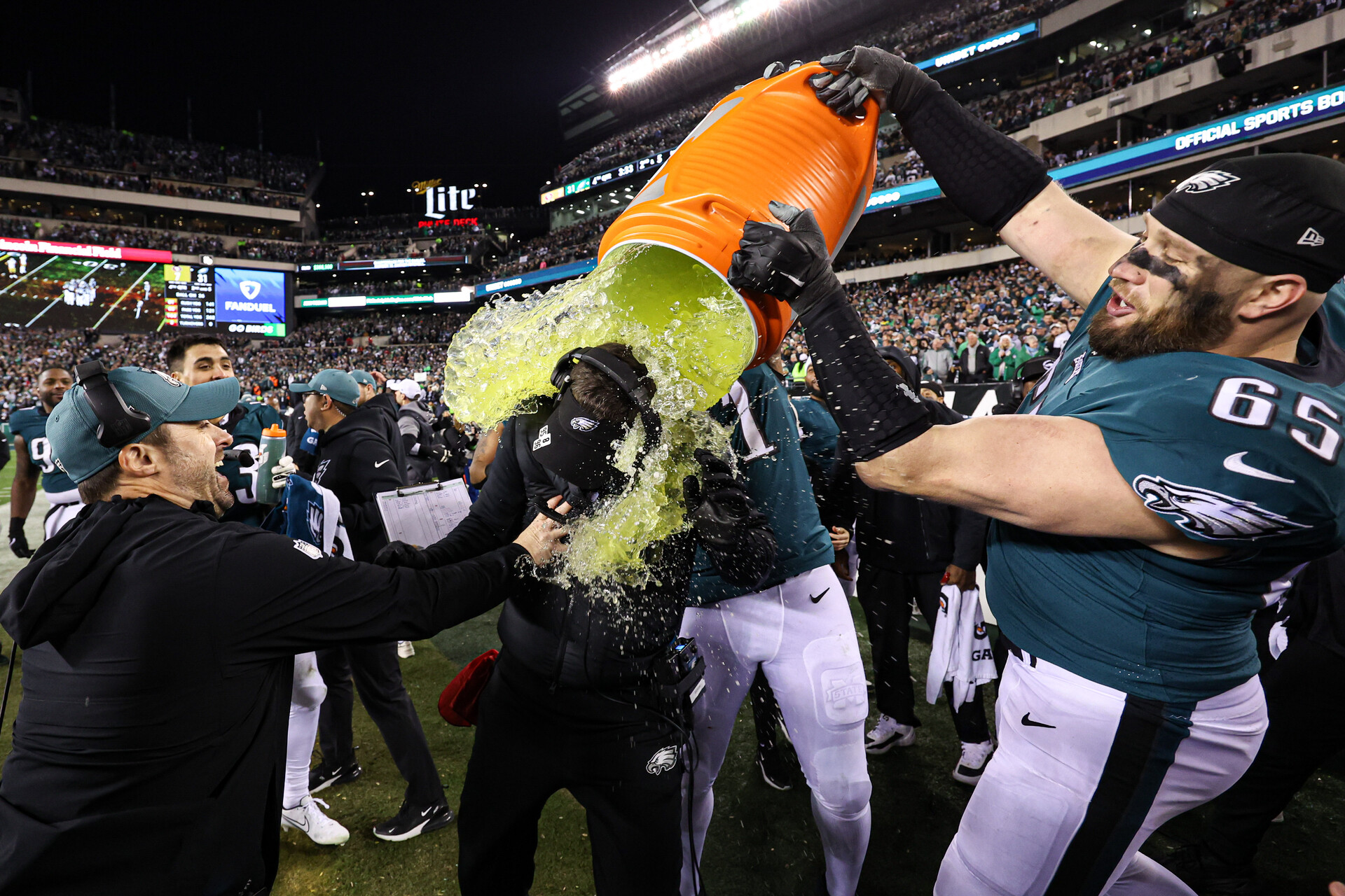 Jan 29, 2023; Philadelphia, Pennsylvania, USA; Philadelphia Eagles offensive tackle Lane Johnson (65) dumps gatorade on head coach Nick Sirianni in the final minutes of a victory against the San Francisco 49ers in the NFC Championship game at Lincoln Financial Field
