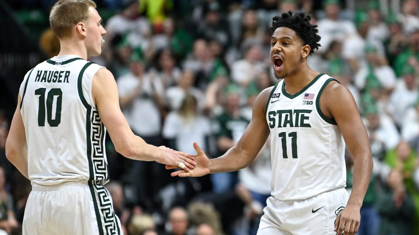 Michigan State's Joey Hauser, left, celebrates his score with A.J. Hoggard during the first half in the game against Maryland on Tuesday, Feb. 7, 2023, at the Breslin Center in East Lansing.