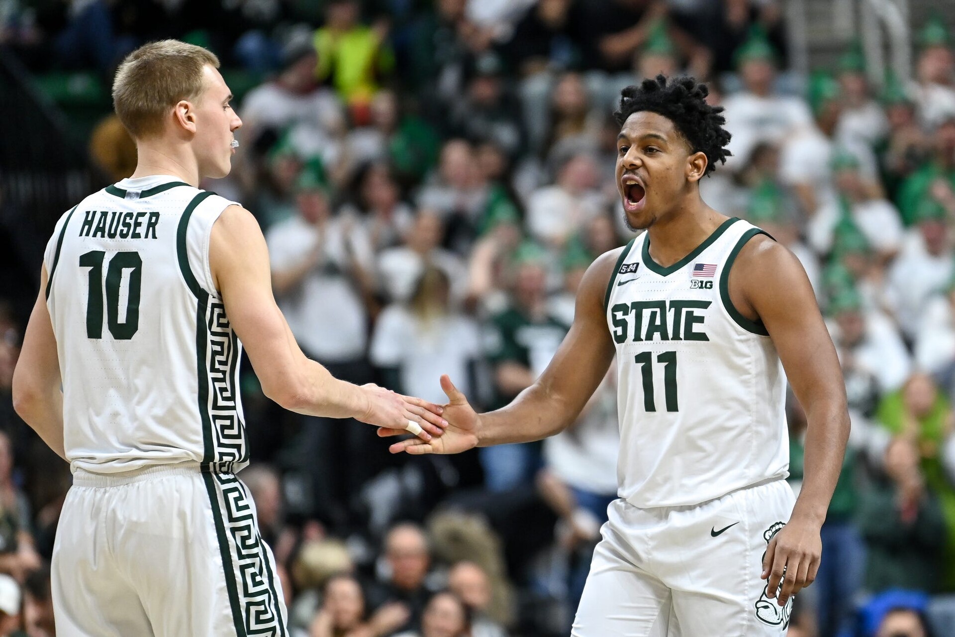 Michigan State's Joey Hauser, left, celebrates his score with A.J. Hoggard during the first half in the game against Maryland on Tuesday, Feb. 7, 2023, at the Breslin Center in East Lansing.
