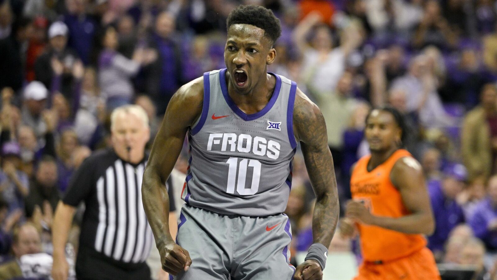 TCU Horned Frogs guard Damion Baugh (10) celebrates after he dunks the ball against the Oklahoma State Cowboys during the first half at the Ed and Rae Schollmaier Arena.