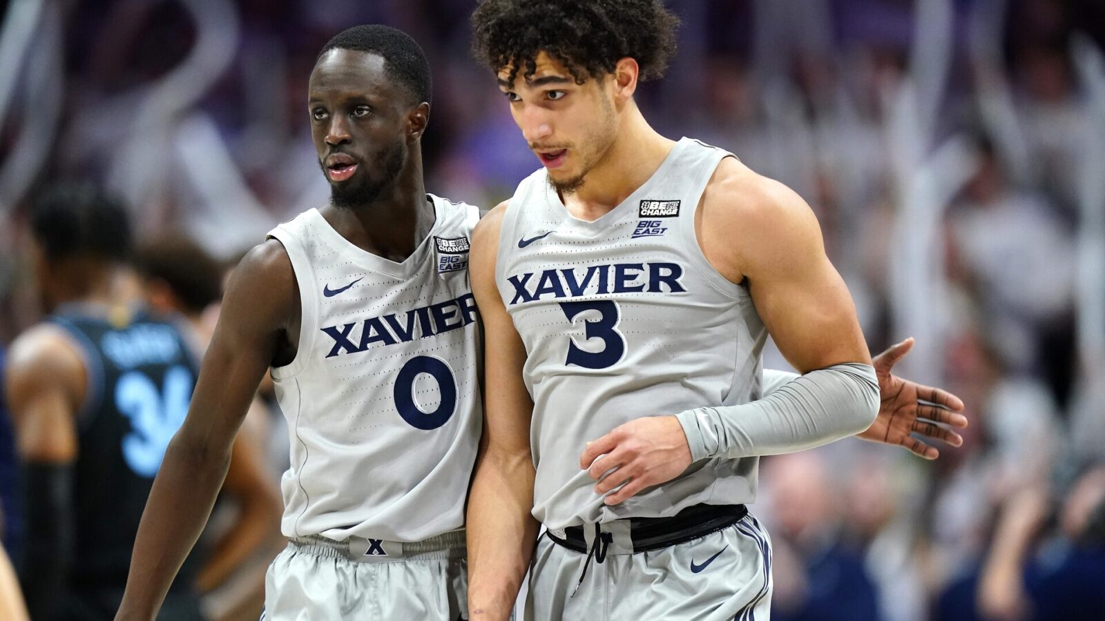 Xavier Musketeers guard Souley Boum (0) and Xavier Musketeers guard Colby Jones (3) walk back to the bench during a timeout in the second half of a college basketball game between the Villanova Wildcats and the Xavier Musketeers, Tuesday, Feb. 21, 2023, at Cintas Center in Cincinnati. The Villanova Wildcats won, 64-63.