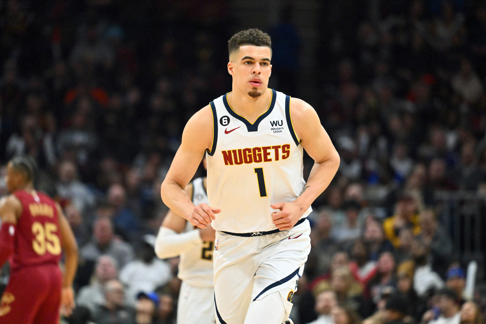 Michael Porter Jr. #1 of the Denver Nuggets runs back on defense during the third quarter against the Cleveland Cavaliers at Rocket Mortgage Fieldhouse on February 23, 2023 in Cleveland, Ohio. The Nuggets defeated the Cavaliers 115-109.