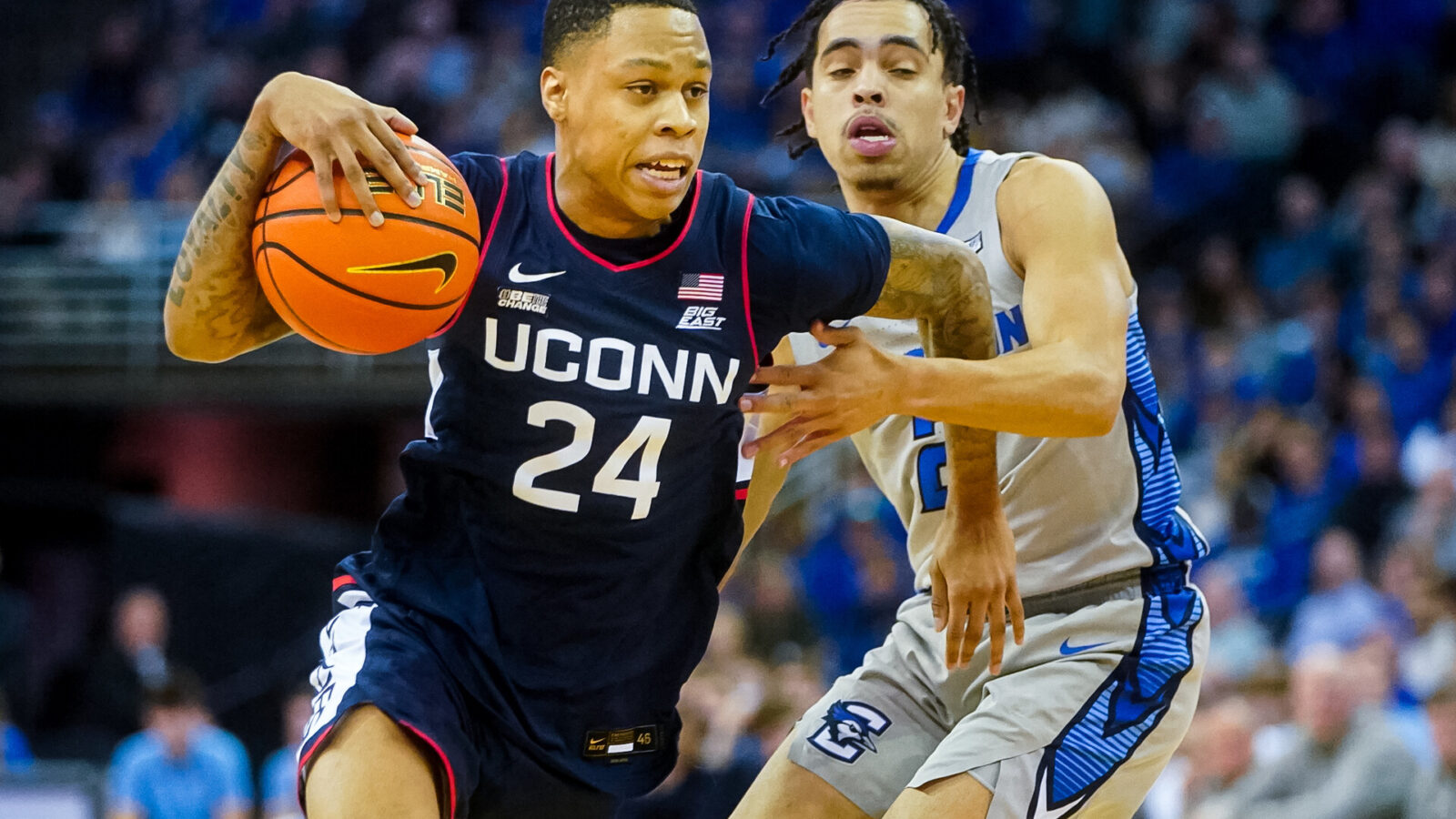 Connecticut Huskies guard Jordan Hawkins (24) drives against Creighton Bluejays guard Ryan Nembhard (2) during the second half at CHI Health Center Omaha.