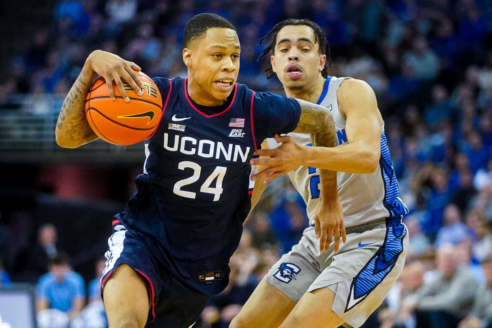 Connecticut Huskies guard Jordan Hawkins (24) drives against Creighton Bluejays guard Ryan Nembhard (2) during the second half at CHI Health Center Omaha.