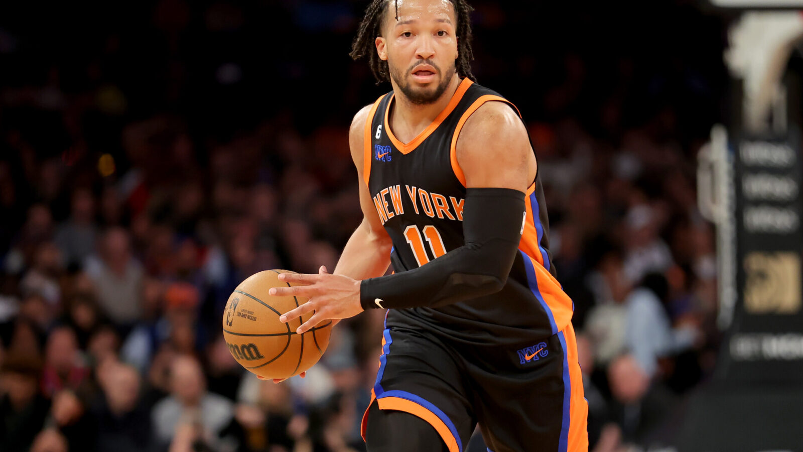 New York Knicks guard Jalen Brunson (11) brings the ball up court against the Brooklyn Nets during the third quarter at Madison Square Garden.