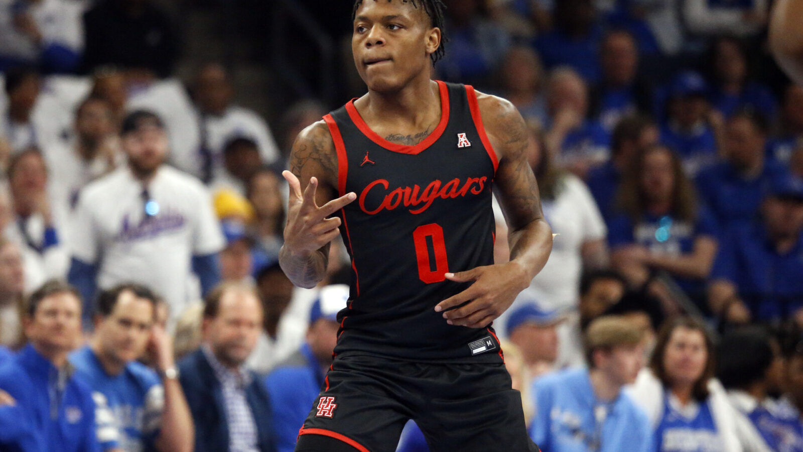 Houston Cougars guard Marcus Sasser (0) reacts after a three point basket during the first half against the Memphis Tigers at FedExForum.