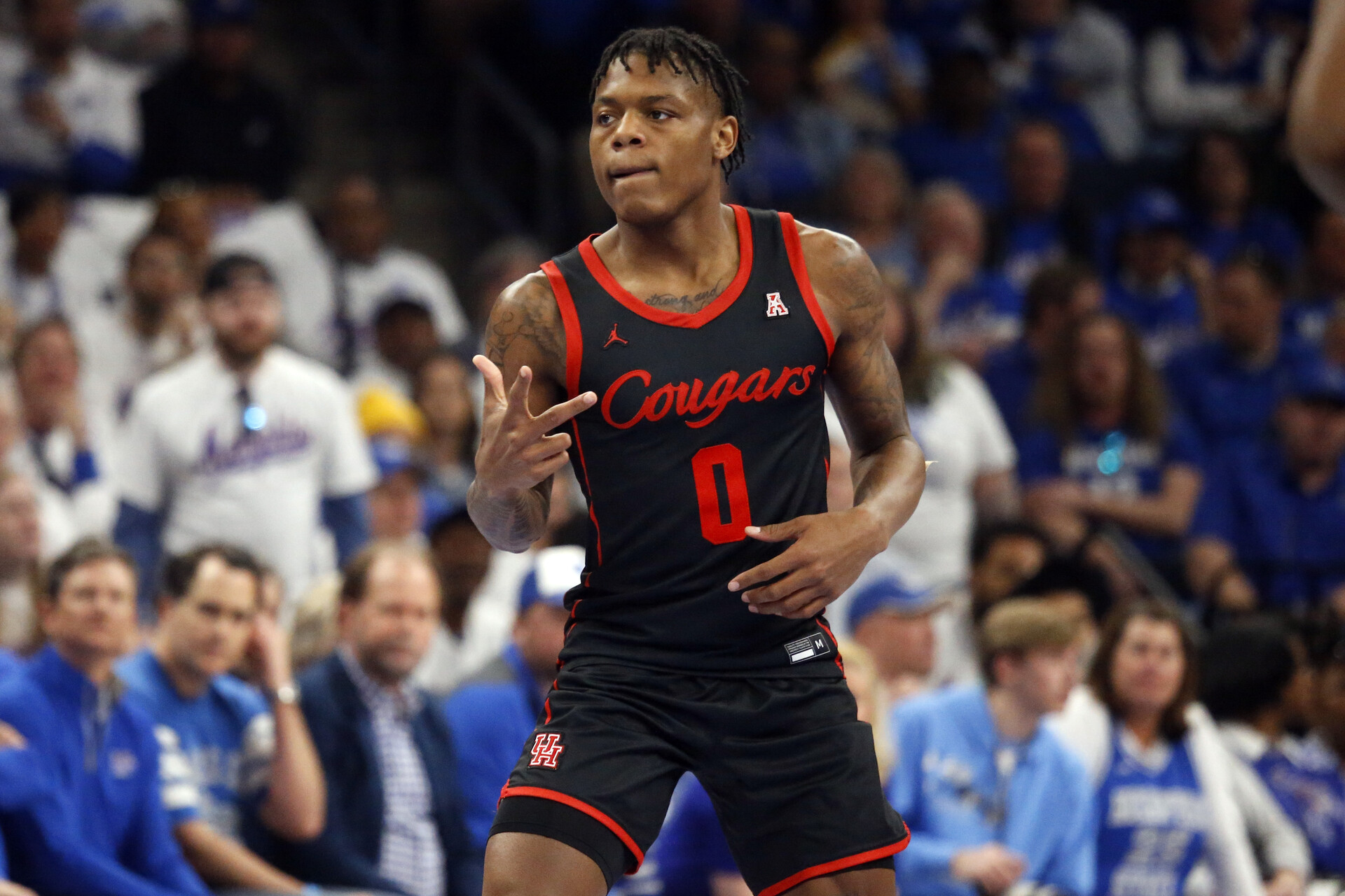Houston Cougars guard Marcus Sasser (0) reacts after a three point basket during the first half against the Memphis Tigers at FedExForum.