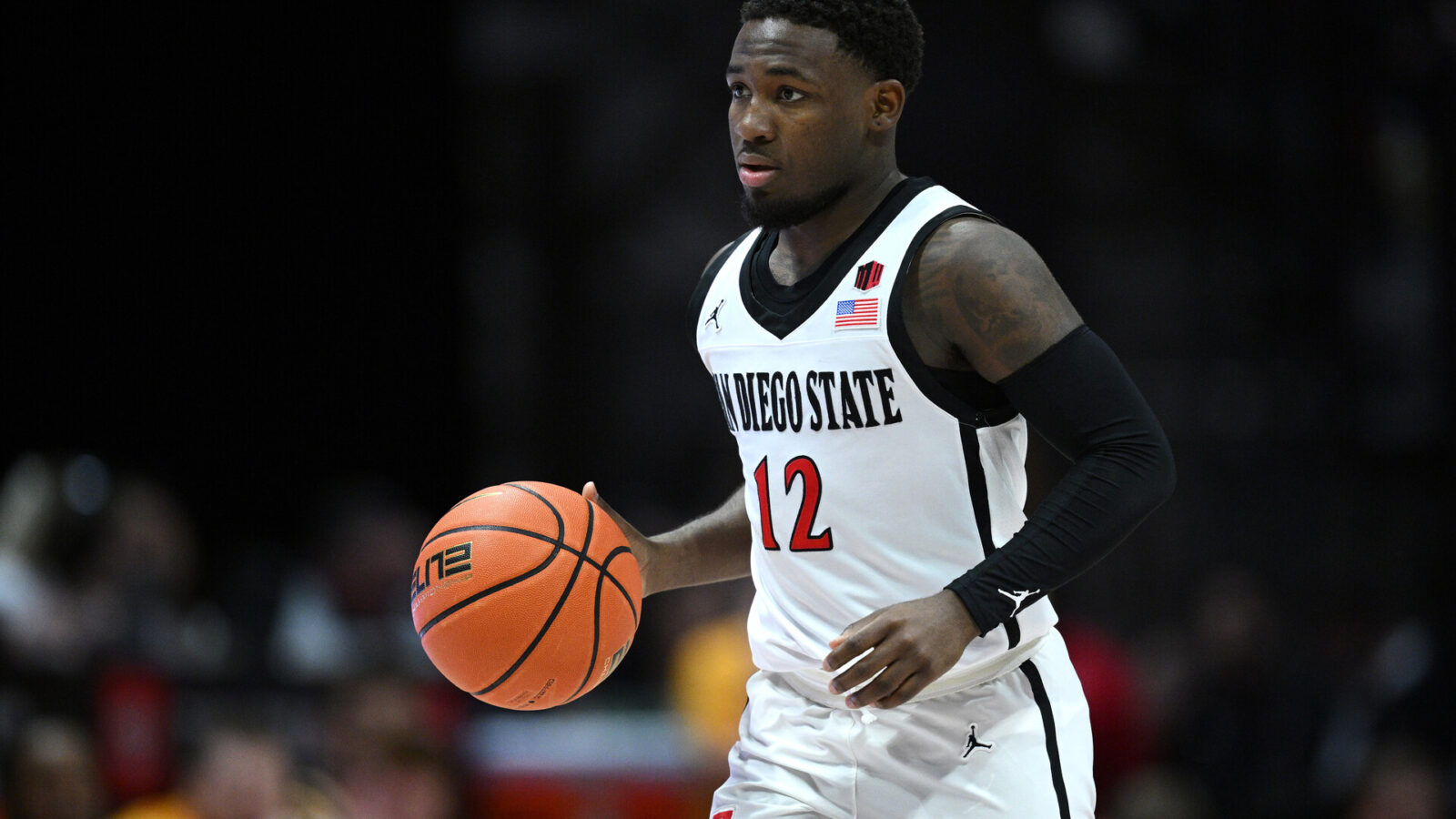 San Diego State Aztecs guard Darrion Trammell (12) dribbles the ball during the second half against the Wyoming Cowboys at Viejas Arena.