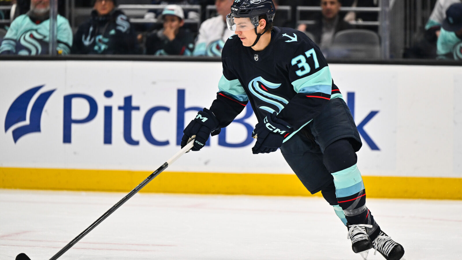 Feb 26, 2023; Seattle, Washington, USA; Seattle Kraken center Yanni Gourde (37) advances the puck during the first period at Climate Pledge Arena. Toronto defeated Seattle 5-1.