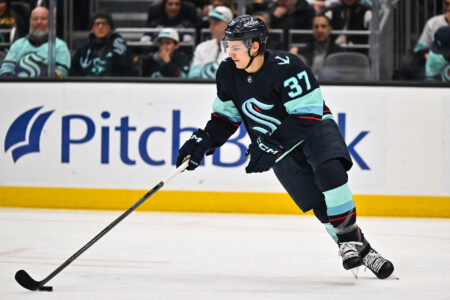 Feb 26, 2023; Seattle, Washington, USA; Seattle Kraken center Yanni Gourde (37) advances the puck during the first period at Climate Pledge Arena. Toronto defeated Seattle 5-1.